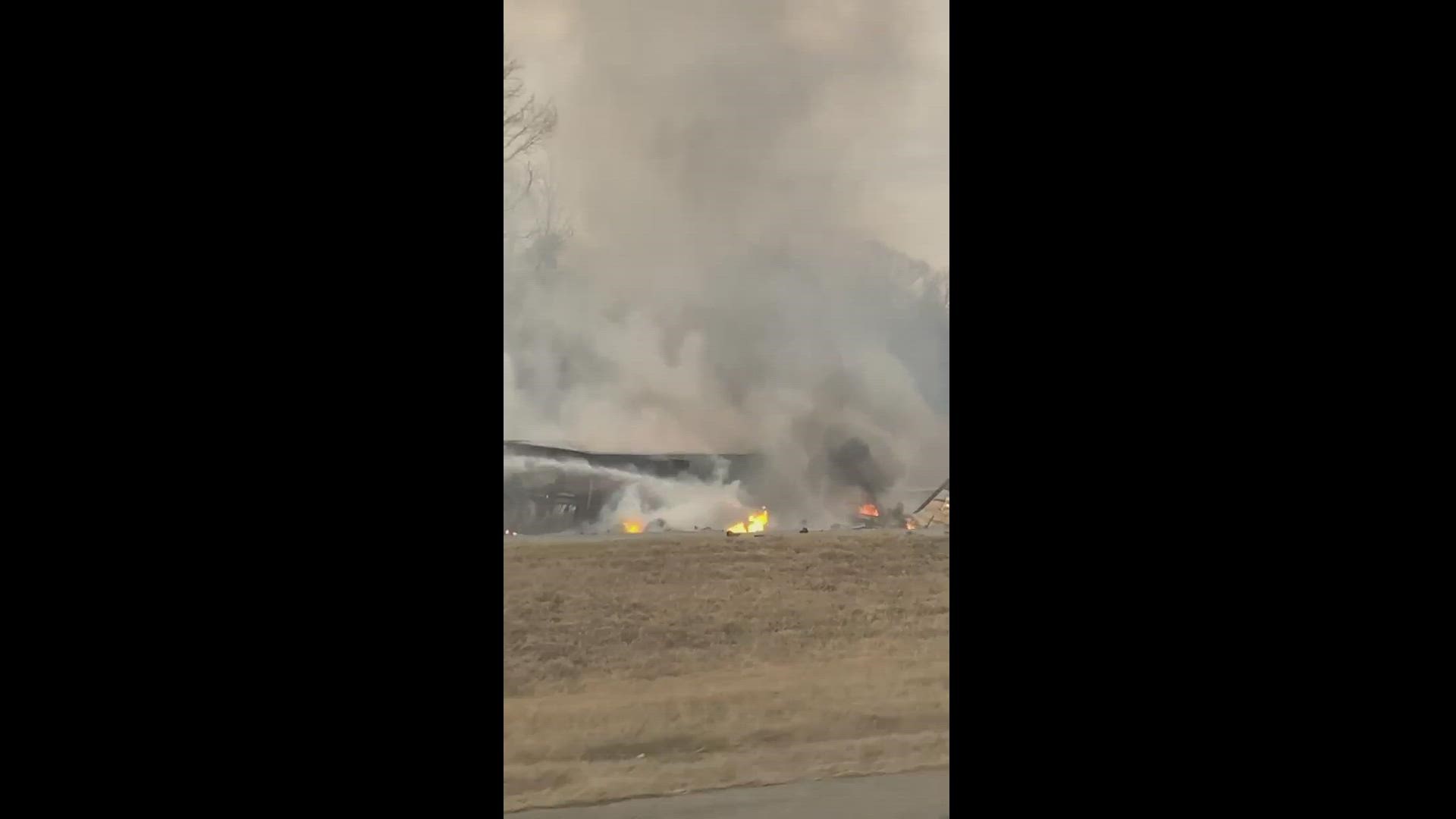 Fire crews worked to douse the flames after a plane crashed and caught fire on I-85 near the Davison County Airport.  Credit: Danny Kelleher