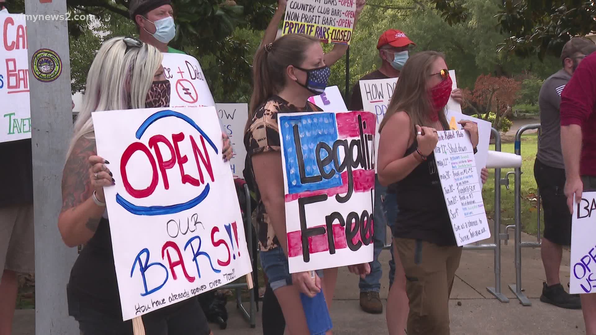 Bar owners stood outside the governor's mansion in Raleigh, pleading for a chance to reopen their businesses.
