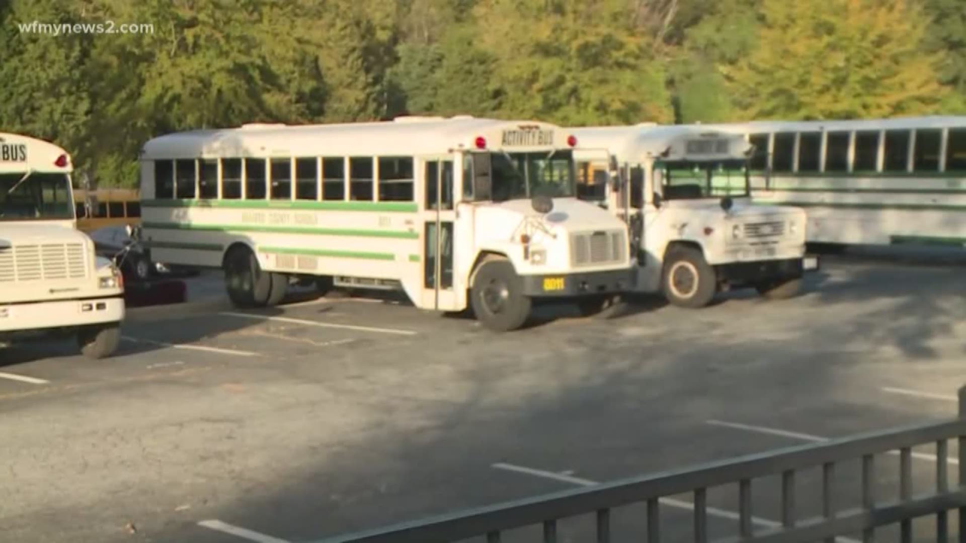 A middle schooler makes his way down the road at about 7-15 in the morning,  gets inside this fence, and takes one of those nice white activity buses for a ride.