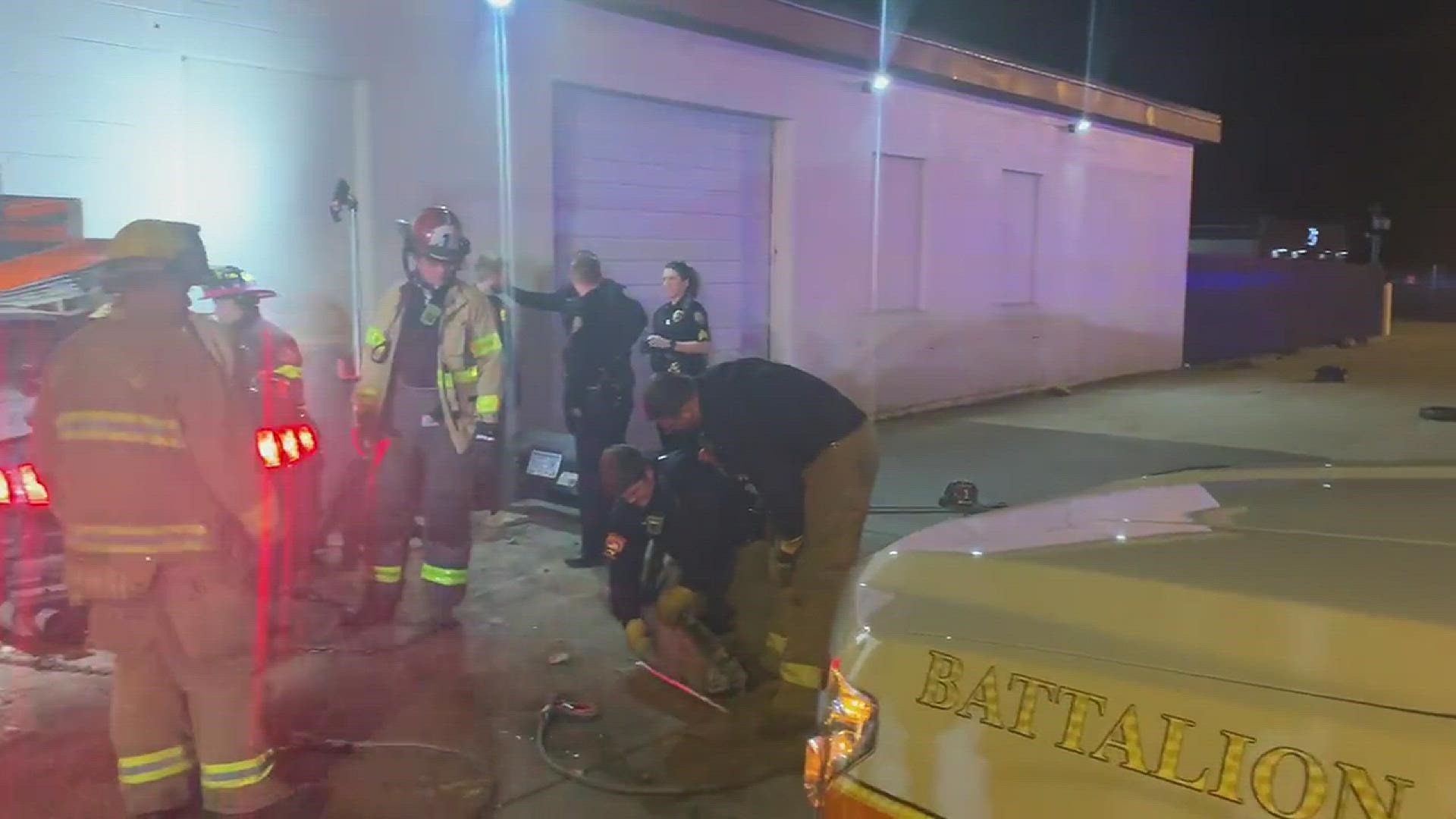 Firefighters rescued a man Wednesday night who was trapped in a car after hitting a building in Winston-Salem. Source: Winston-Salem Fire