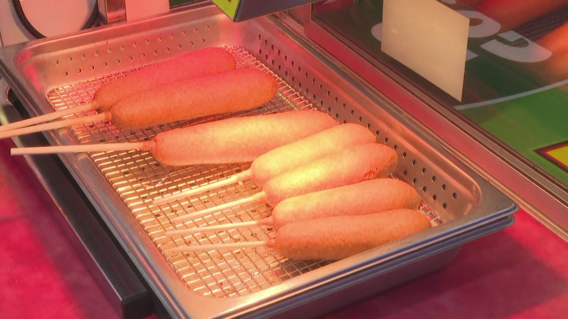 Hunter Funk gets a walk-through. on how to make the perfect corndog and some of the other tasty treats at the Central Carolina Fair.