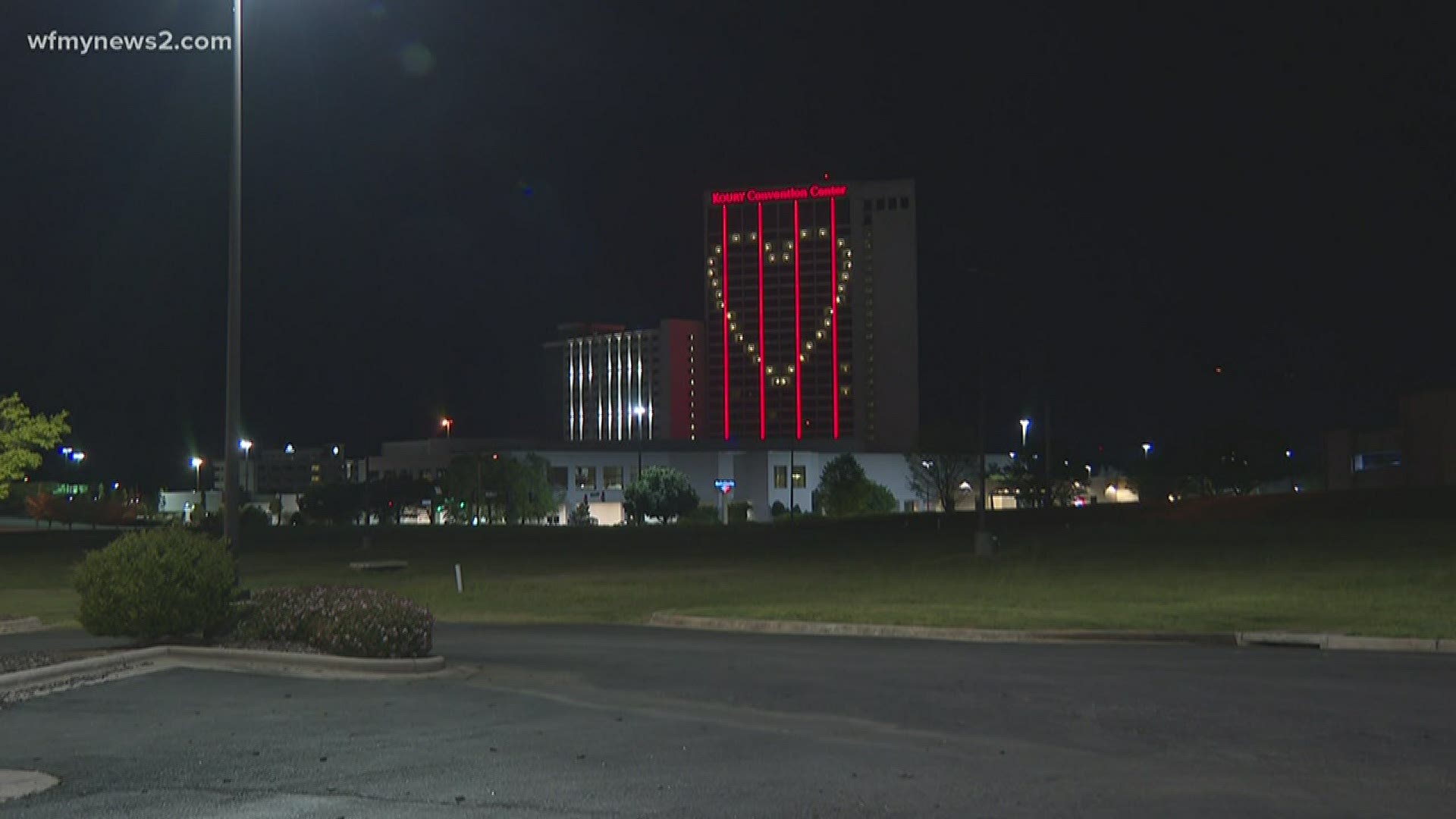 The Koury Convention Center shines a hopeful message to folks driving along I-40.