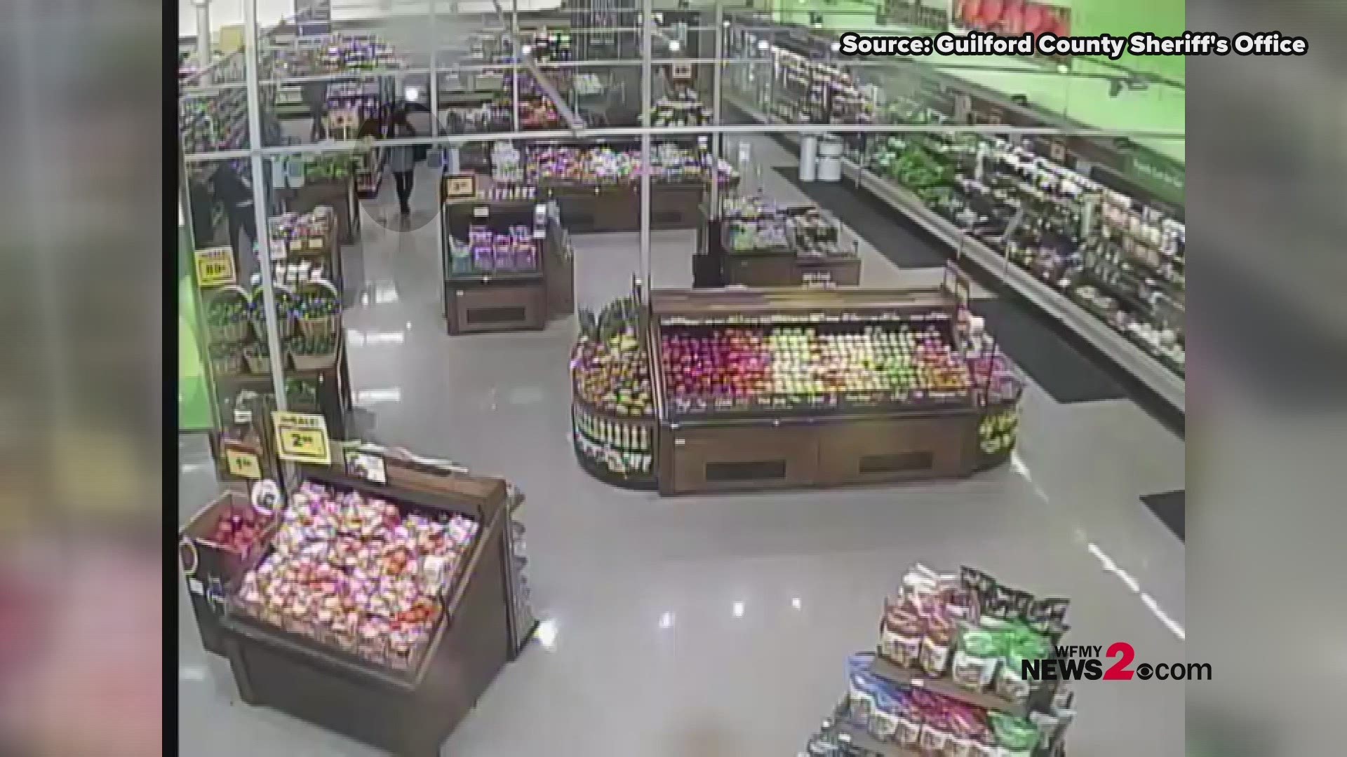 Guilford Co. detectives released surveillance video that appears to show a woman placing something in her shopping basket. In the last clip, she leaves with a purse.