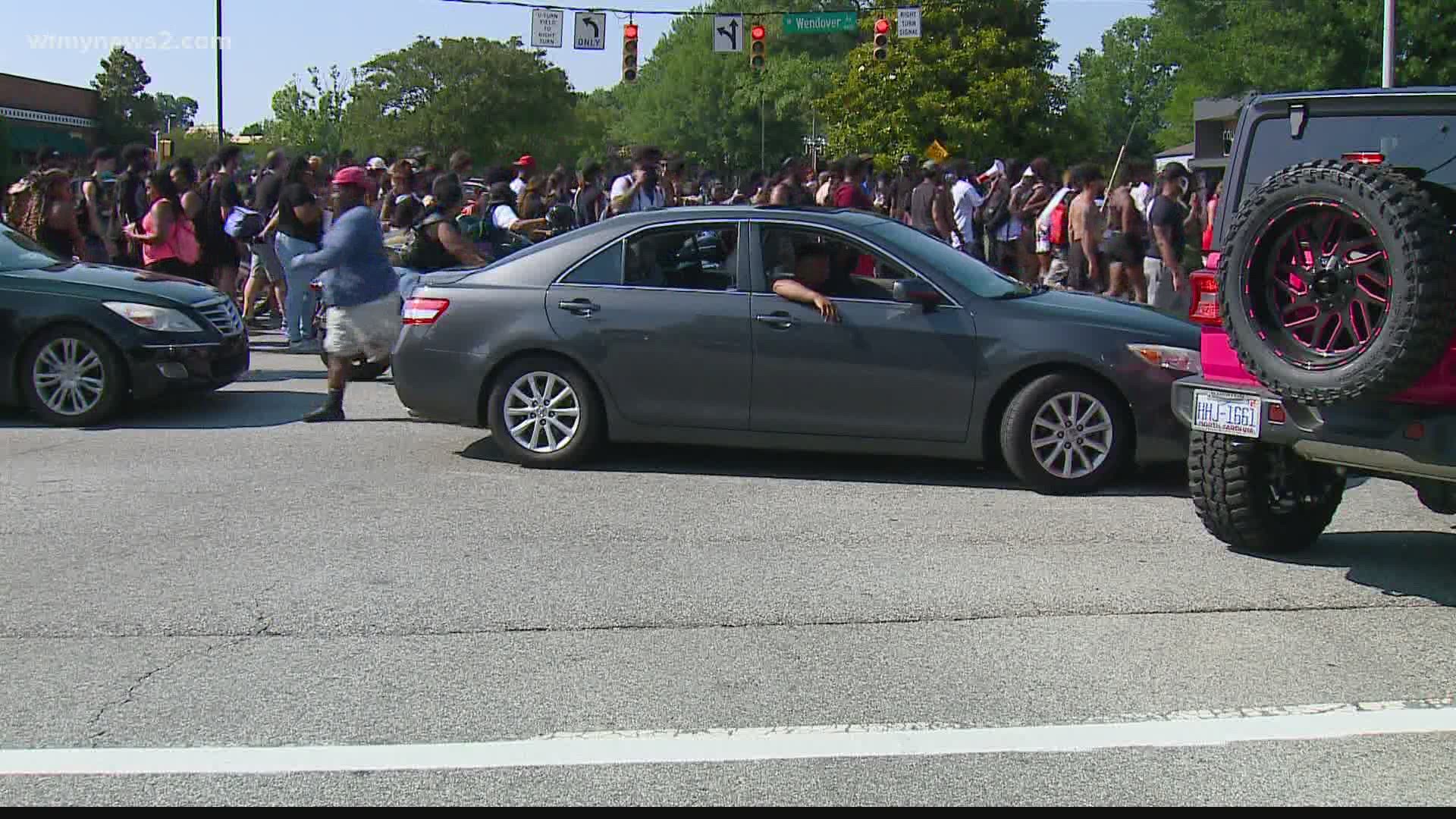 Parts of W. Wendover Avenue in Greensboro were shut down Sunday afternoon to accommodate a group of protesters.