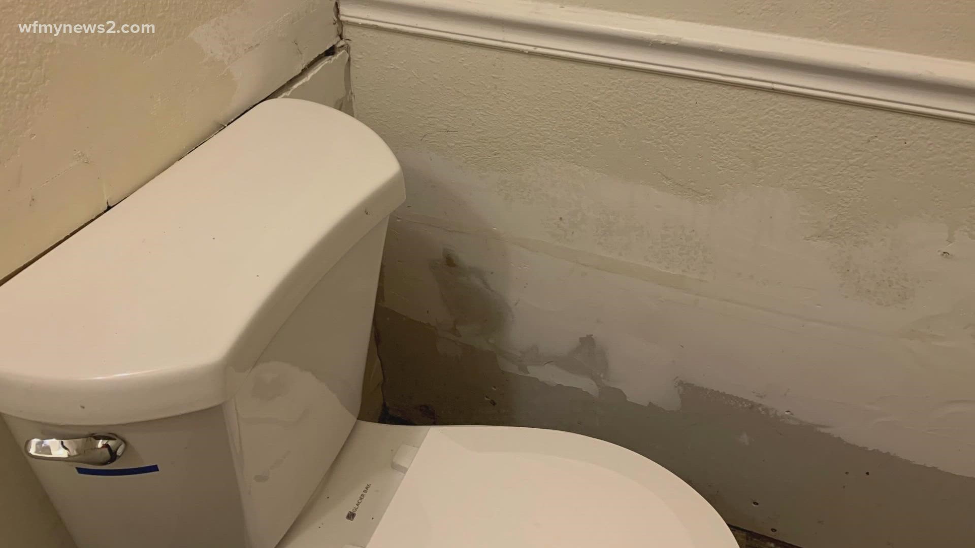A Greensboro woman had to pay for her own hotel after sewage repairs forced her from her apartment.