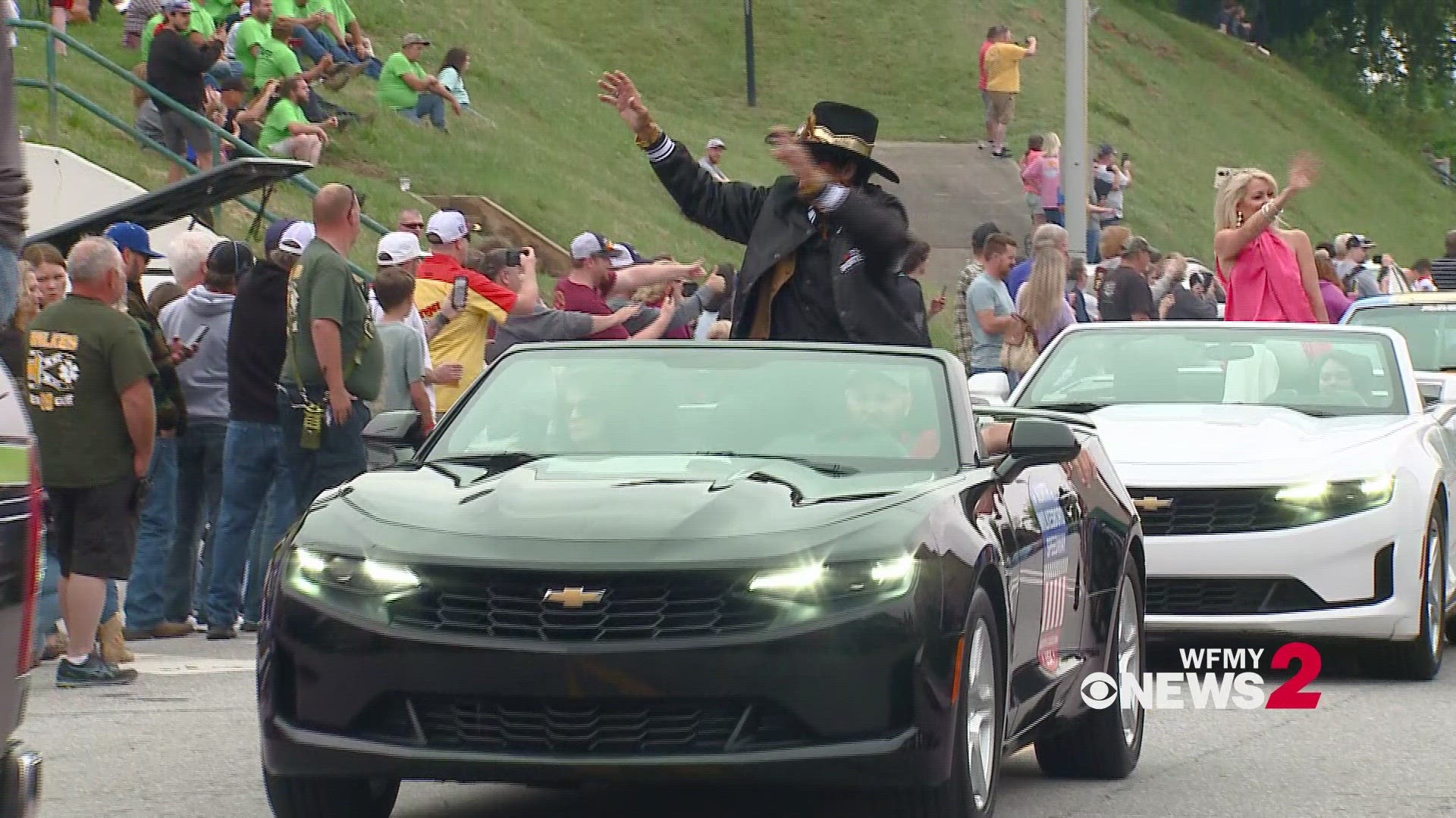 Richard Petty led NASCAR trucks through Wilkes County as fans watched the haulers carrying their favorite driver's cars.