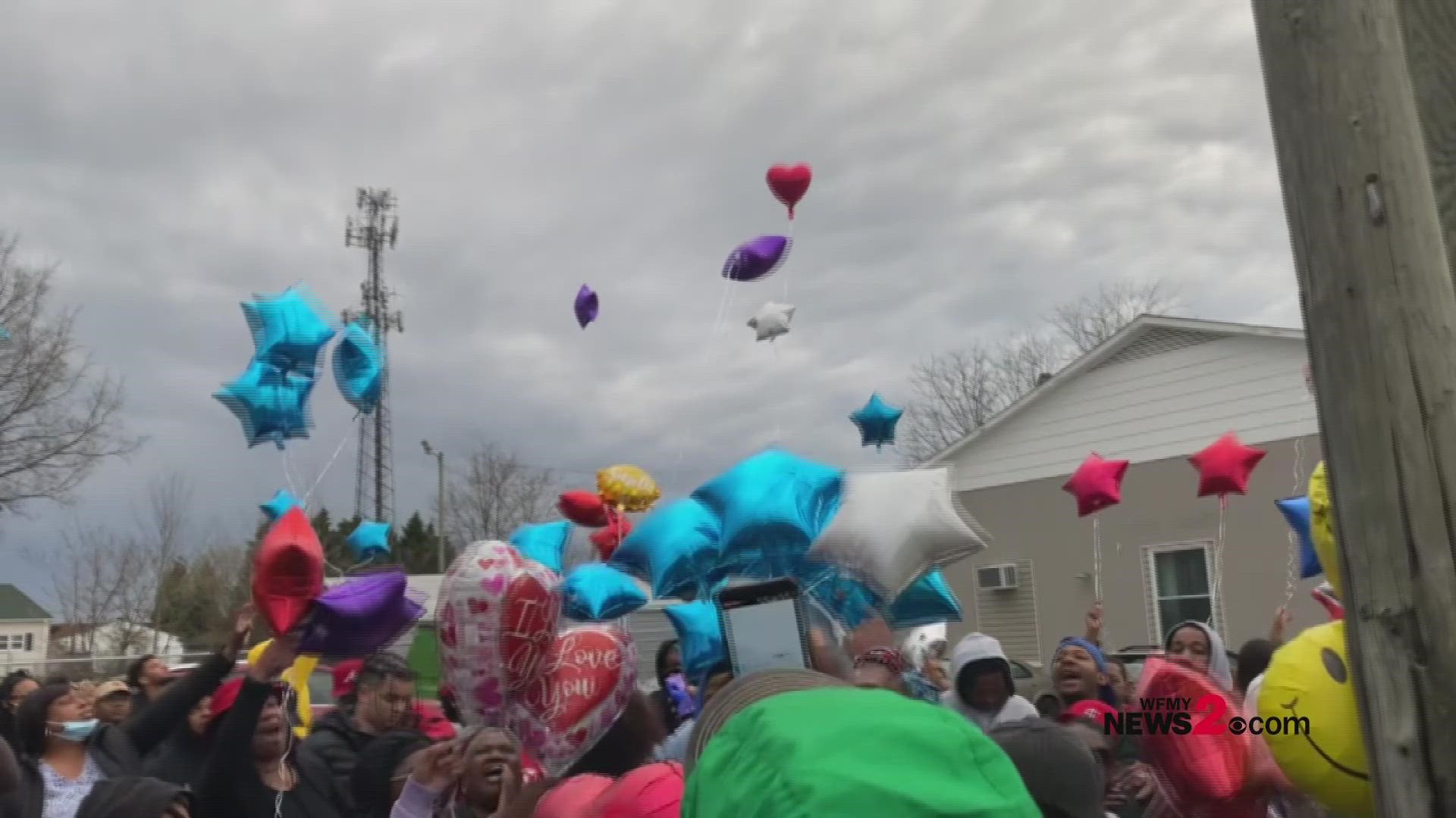 Family and friends release balloons at a vigil in memory of Toriyana Marquez Gaskins.