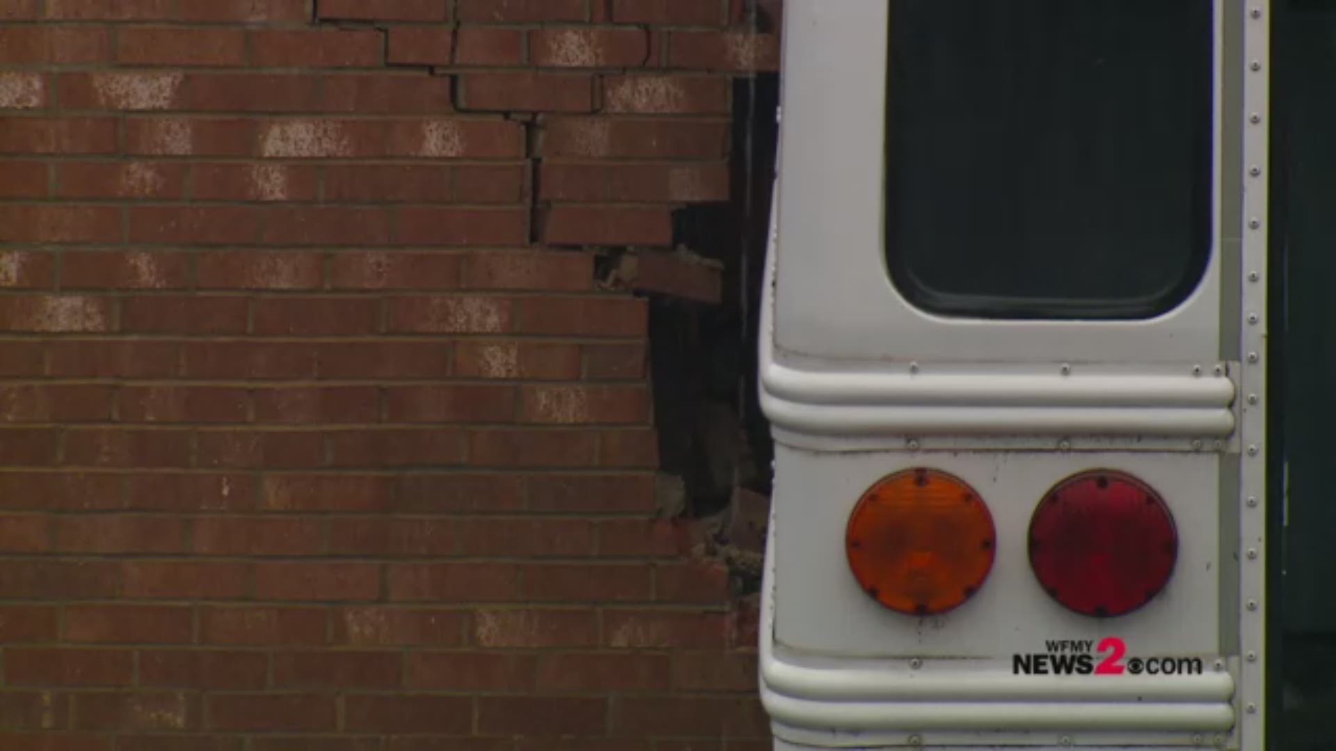A NC State Highway Patrol Trooper says the driver of a La Petite Academy bus hit a building while trying to avoid hitting a car that pulled in front of the bus. There were two children on the bus and they were not injured. The driver is okay as well.