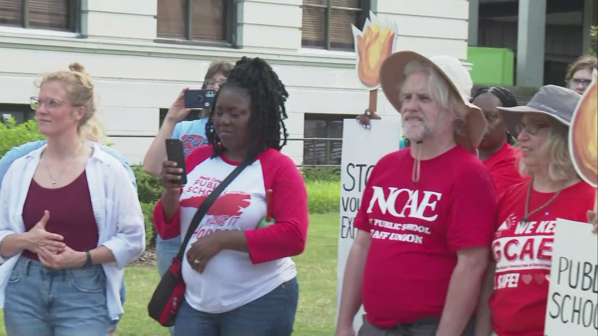 GCAE holds rally ahead of county commissioners meeting demanding more money.