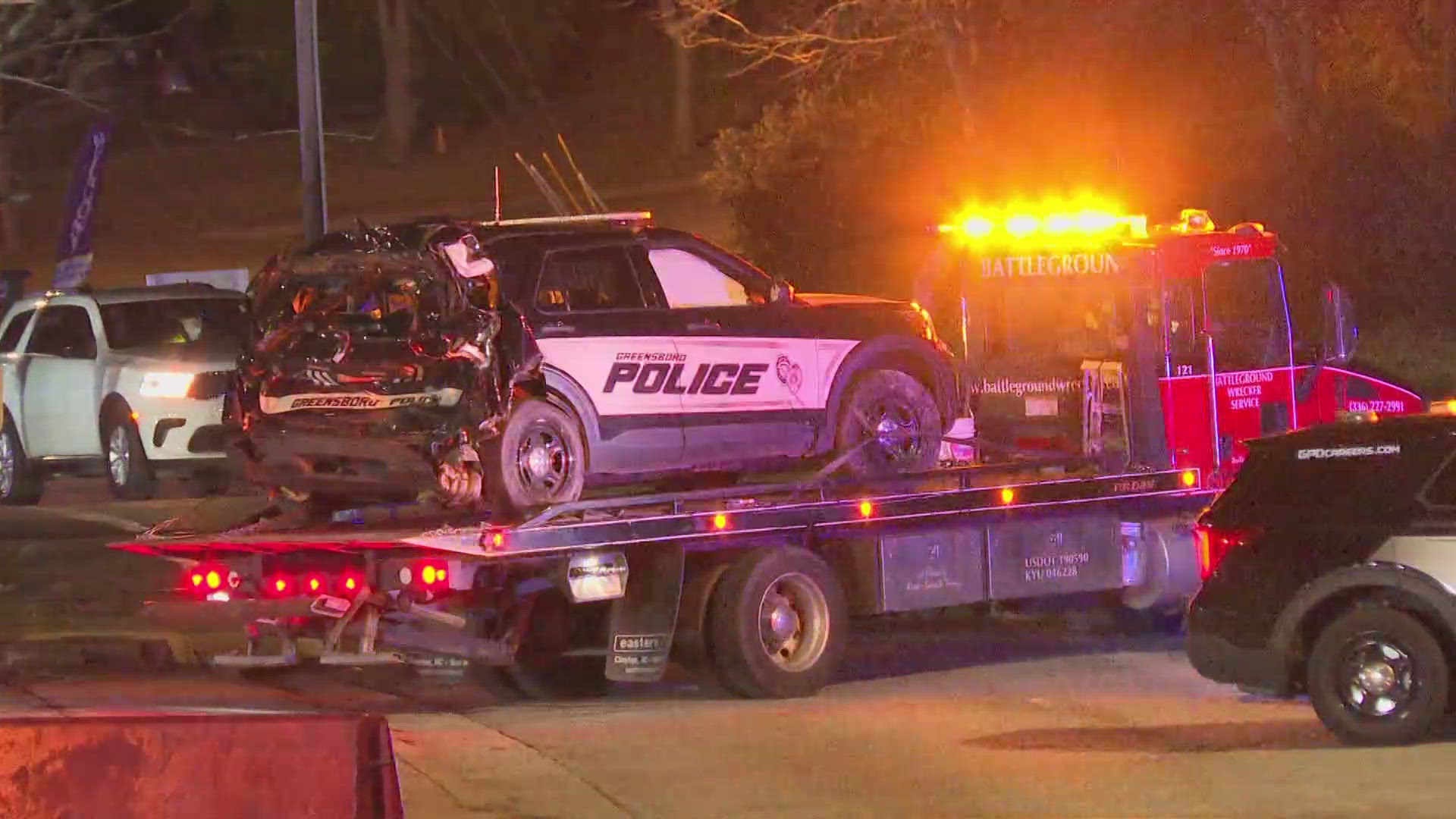 A train hit a police car while an officer responded to another crash.