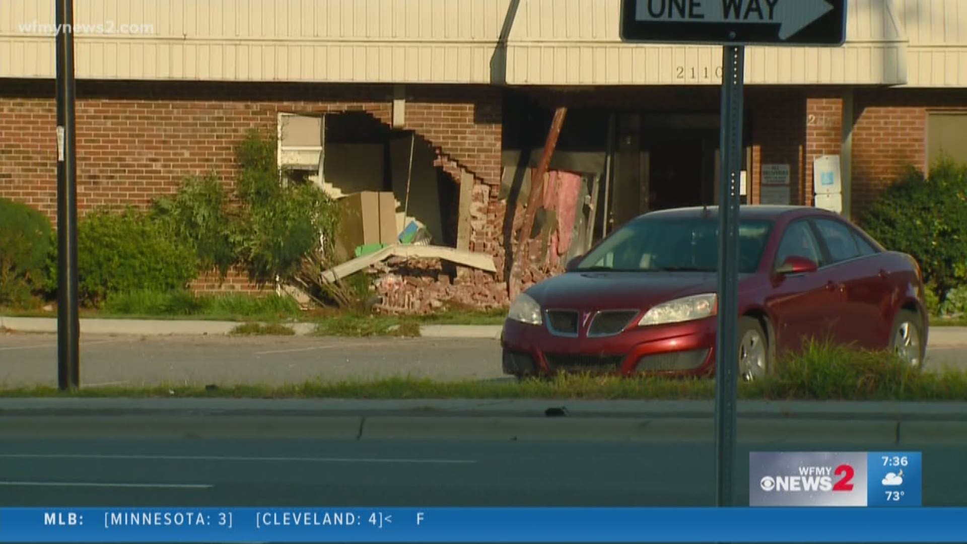 One person is dead after an SUV slammed into a building in Greensboro.