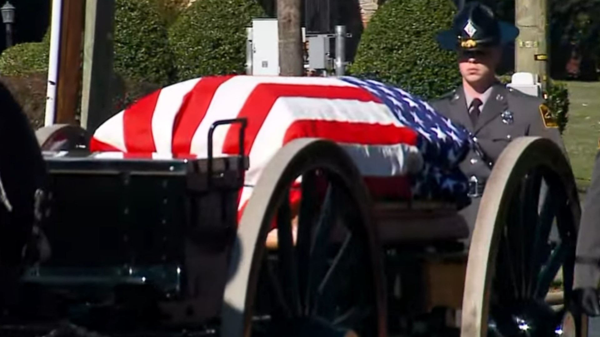 The body of Sgt. Dale Nix is being carried to Westover Church on a horse drawn military wagon