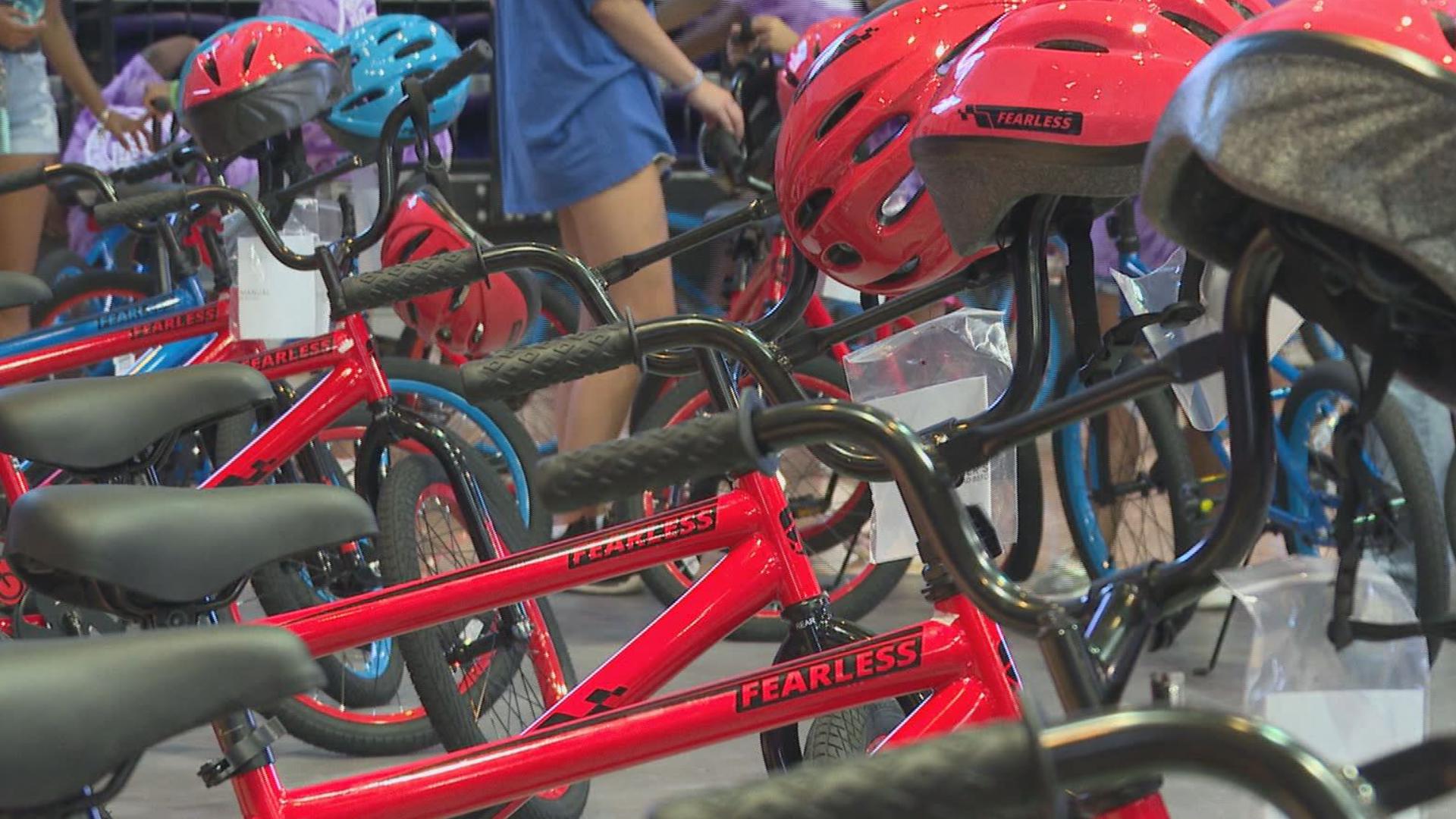 Students built 150 bikes and handed them out to kids.