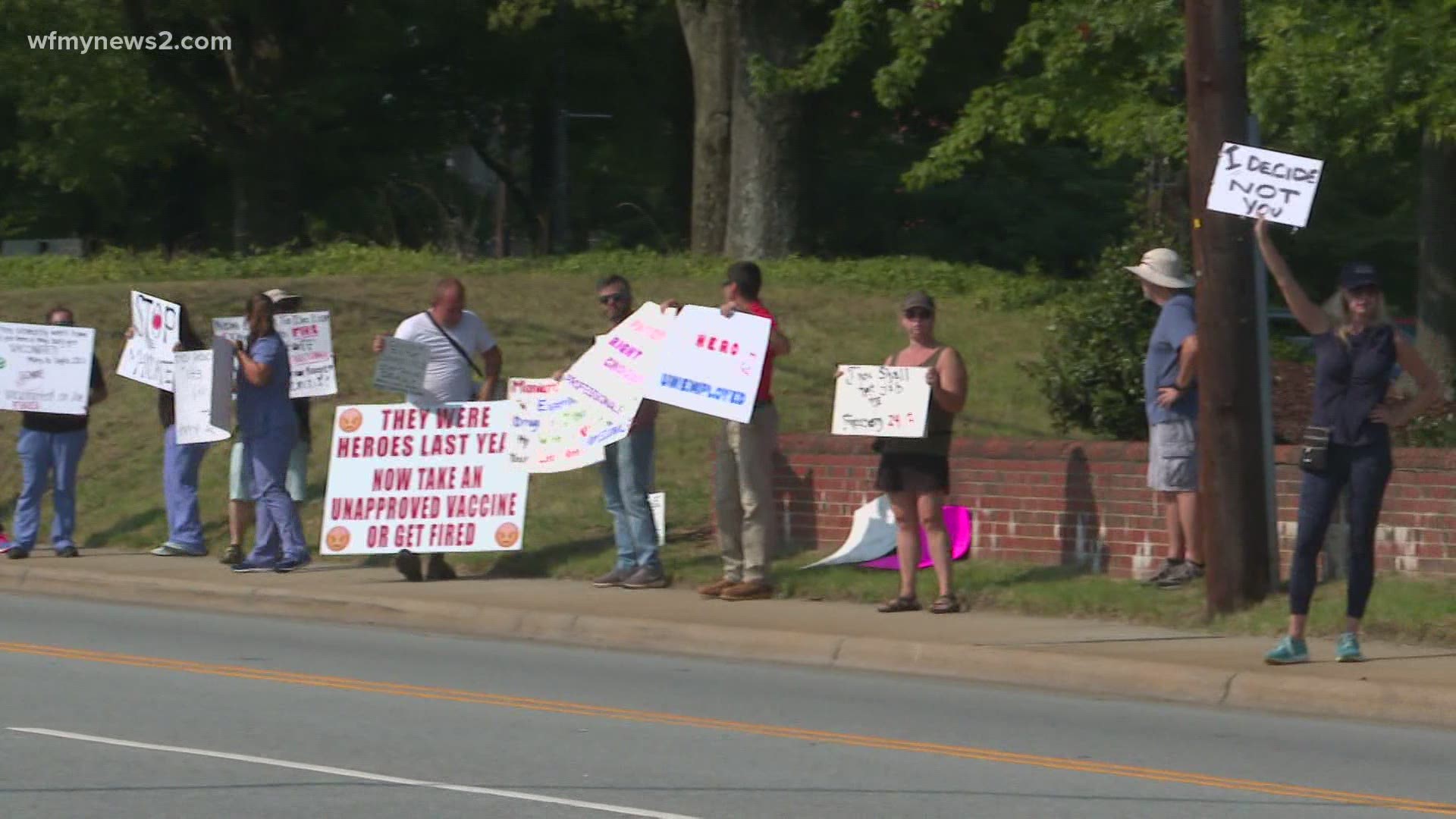 Some Cone Health workers took to the streets, Thursday to protest mandatory vaccinations for all hospital staff.