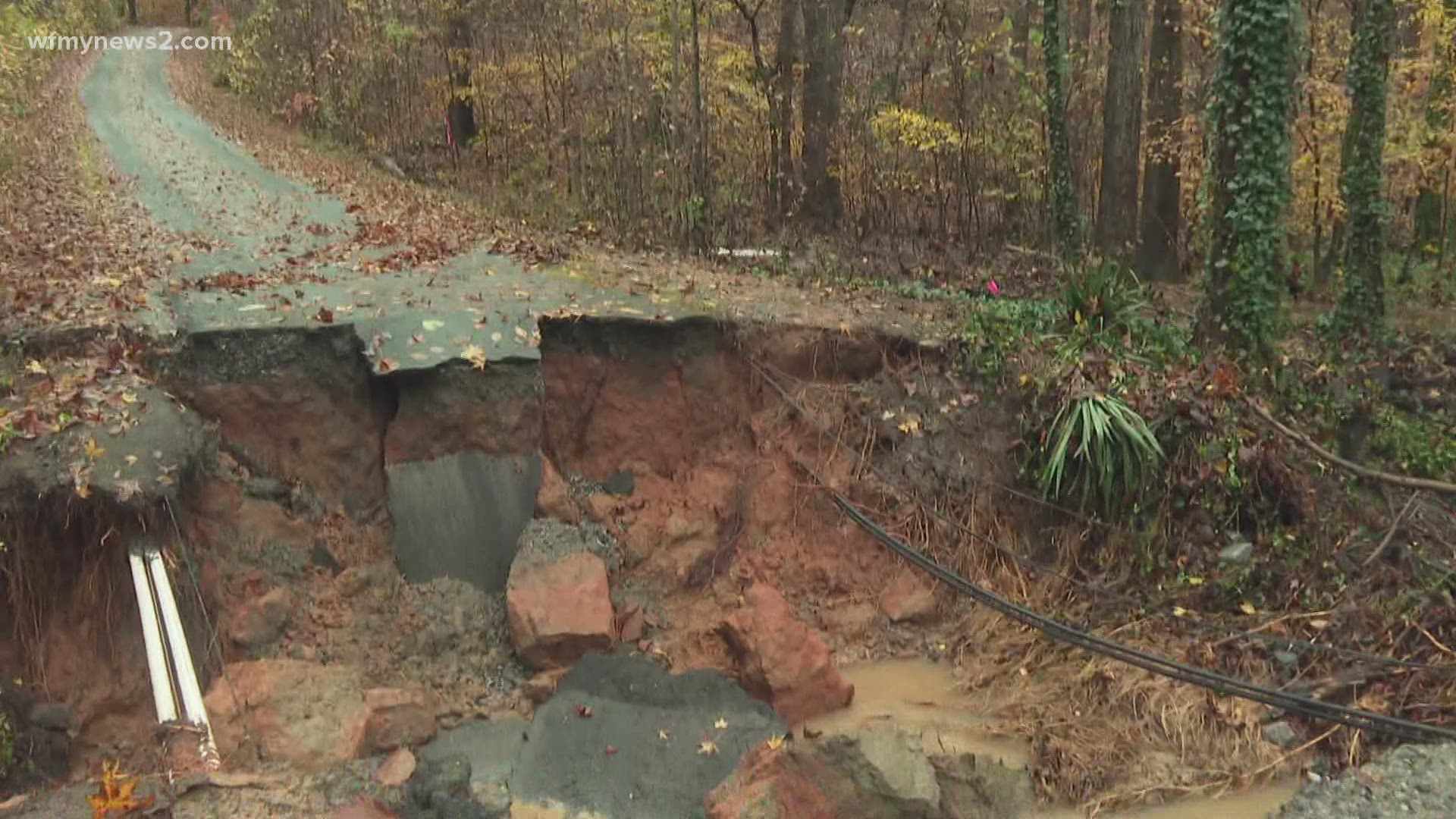 Neighbors say it happened during a heavy downpour around 7 p.m. Wednesday that stranded two families.