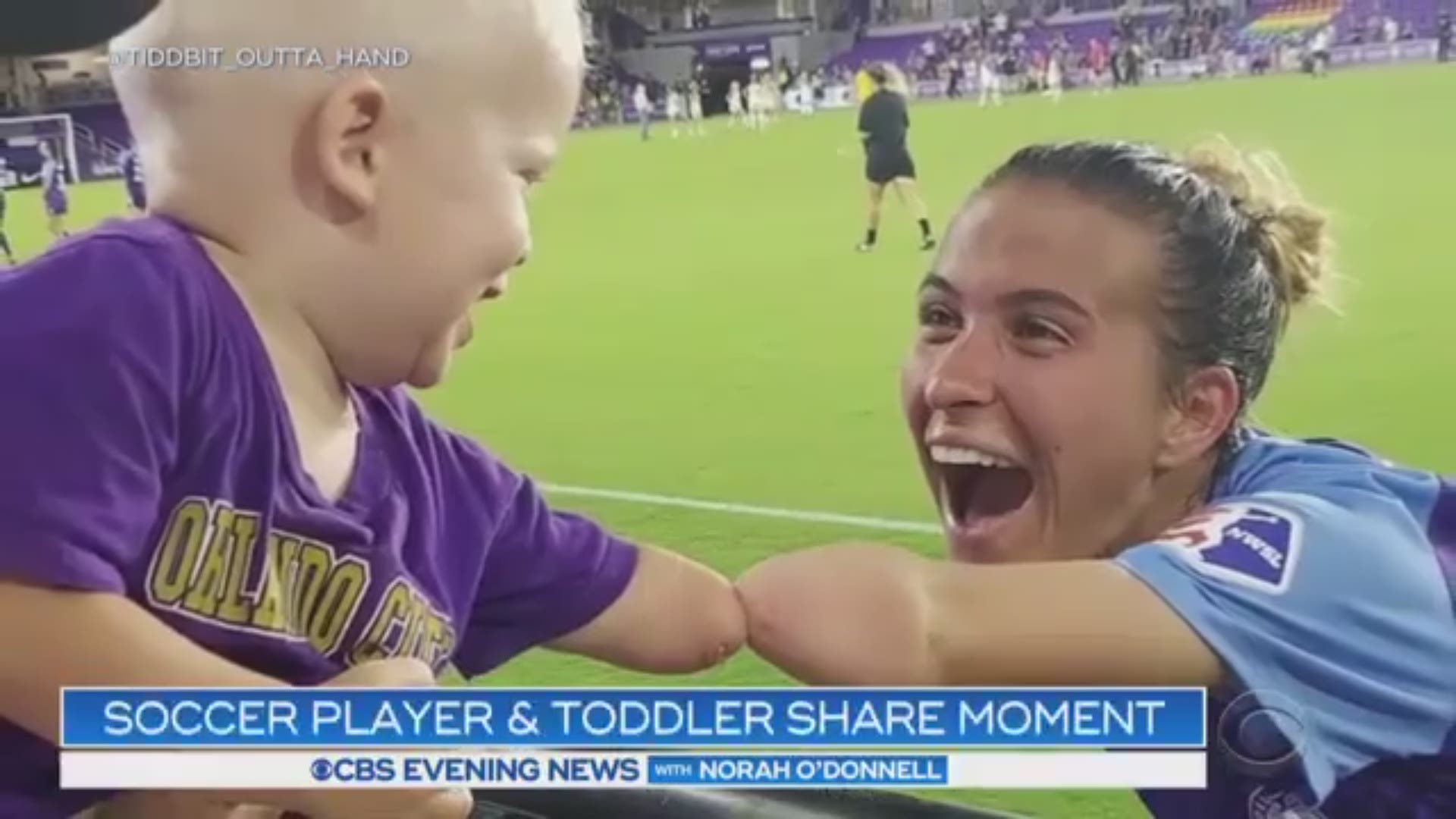 Orlando Pride soccer player Carson Pickett was captured bumping elbows with 2-year-old fan Joseph Tidd in a photo that has now gone viral; Pickett calls the young boy a role model because he understands her in a way that others don't.