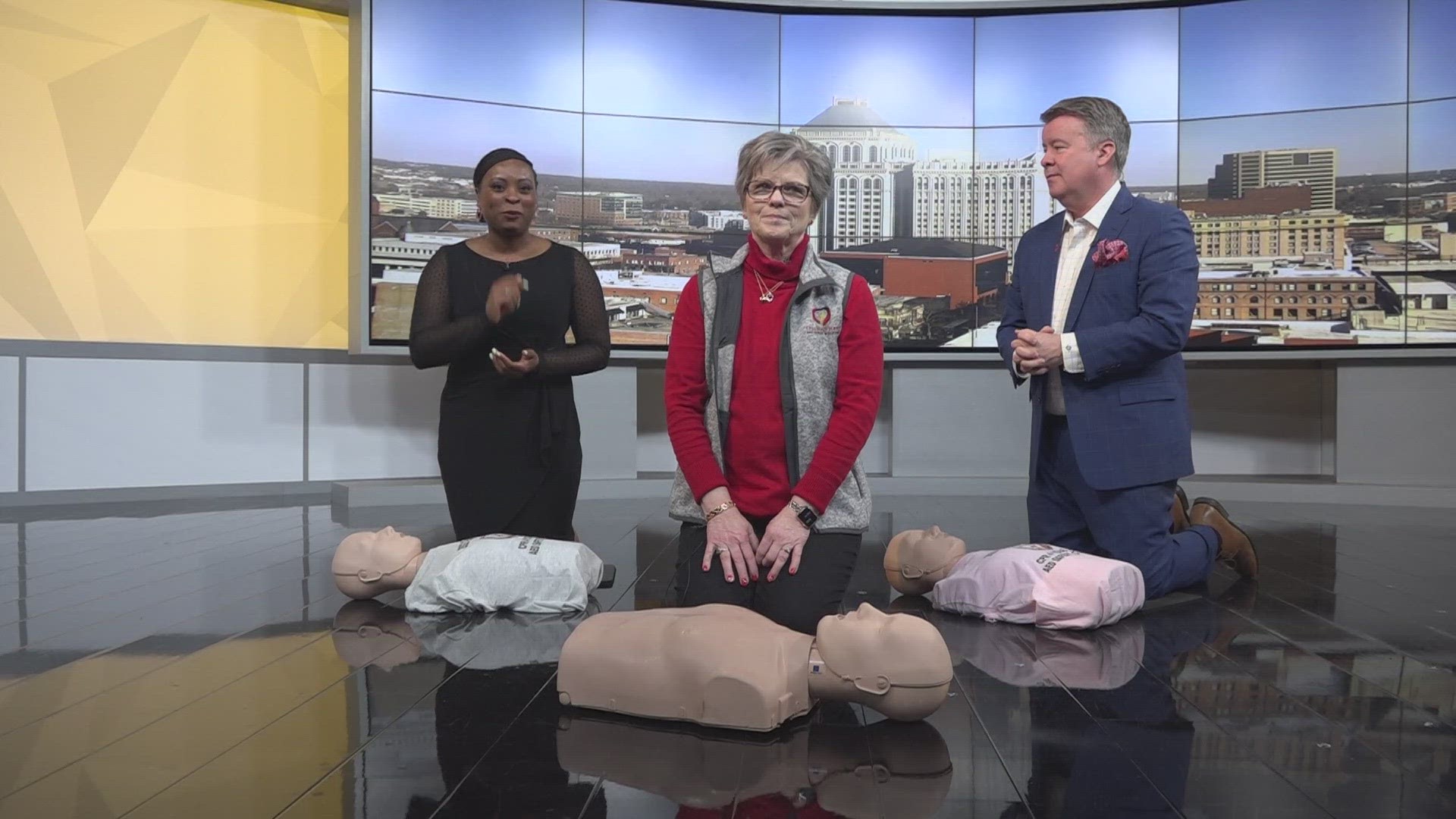 President/CEO of CPR for Your Heart Kim Bass demonstrates how to perform CPR.