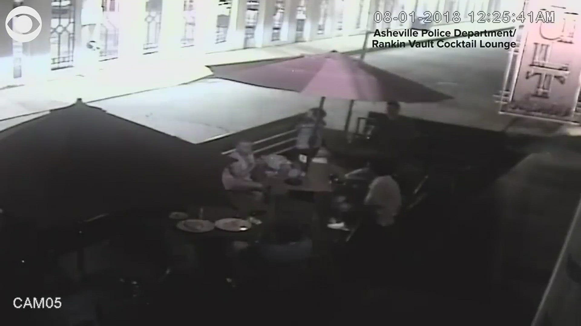 Asheville police released surveillance video showing an SUV whizzing past the patio tables just before the firework explodes, showing the area with sparks as people scramble for safety.