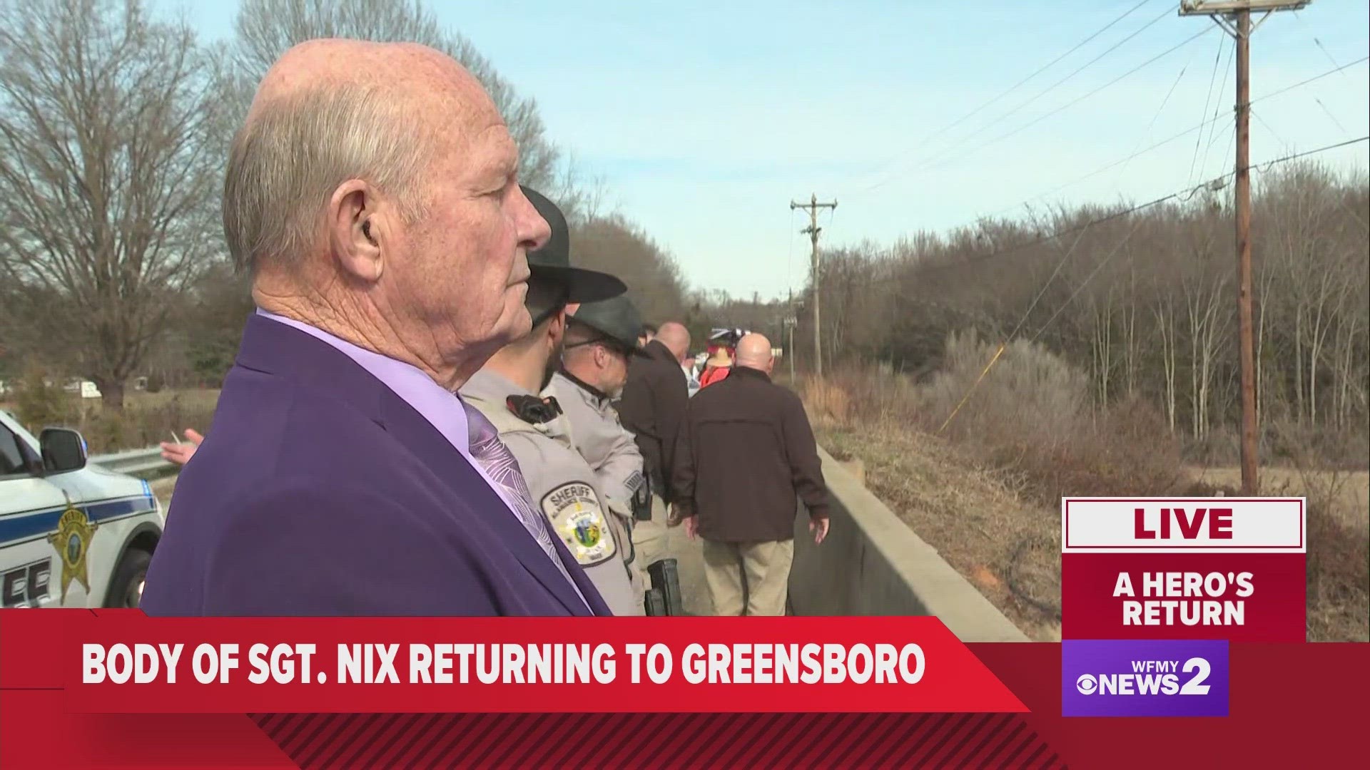 Alamance County Sheriff Terry Johnson waits on a bypass for the body of Sgt. Philip Dale Nix to pass through