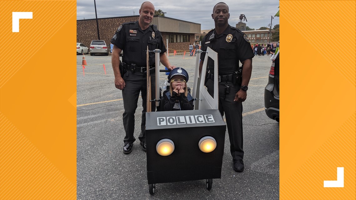 NC girl turns wheelchair into police car for Halloween costume