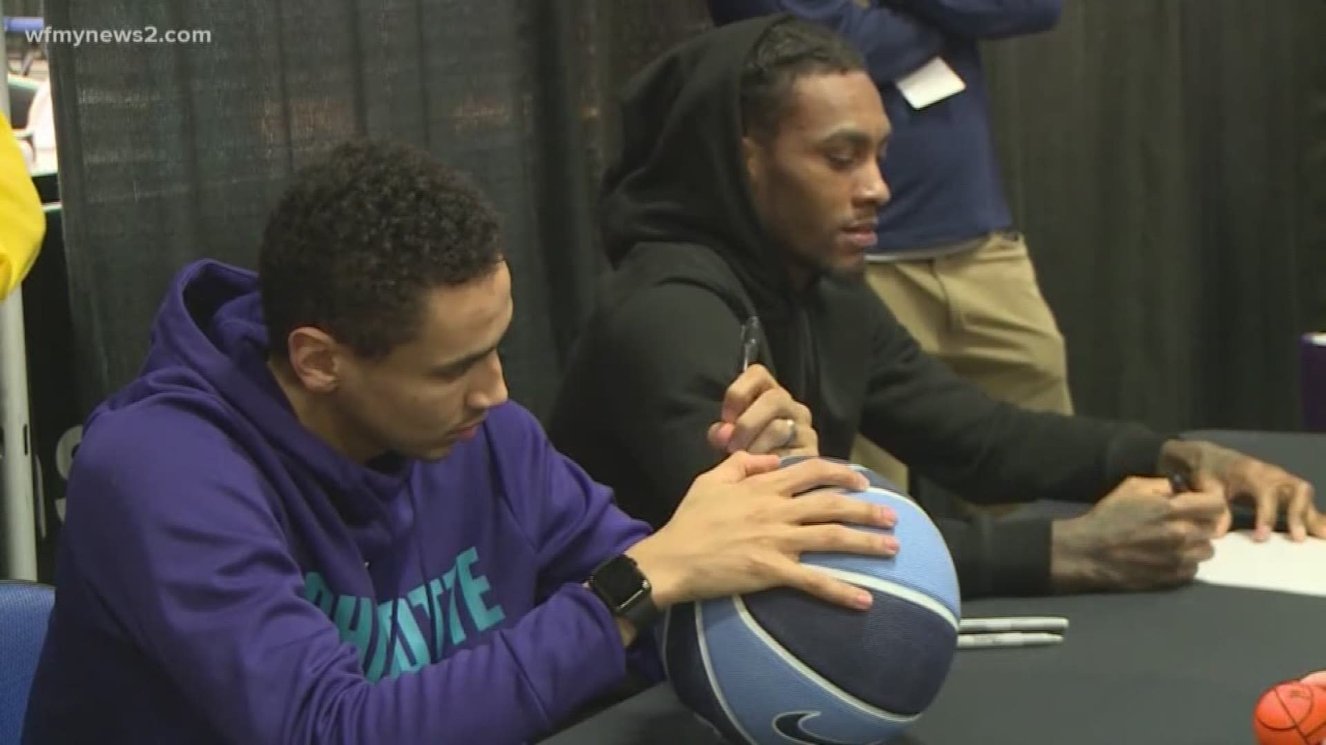 Marcus Paige and Cat Barber Sign Autographs