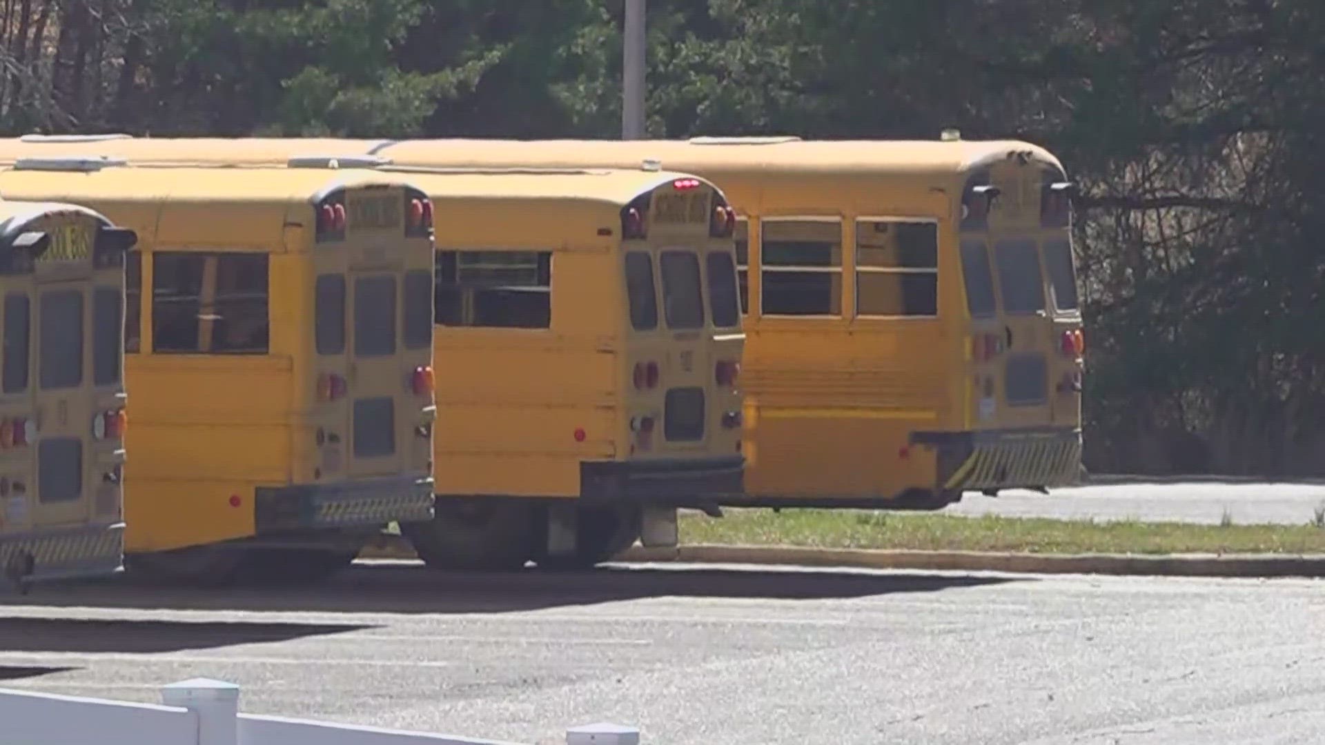 Two parents are facing charges after being accused of assaulting a student on a Randolph County school bus.