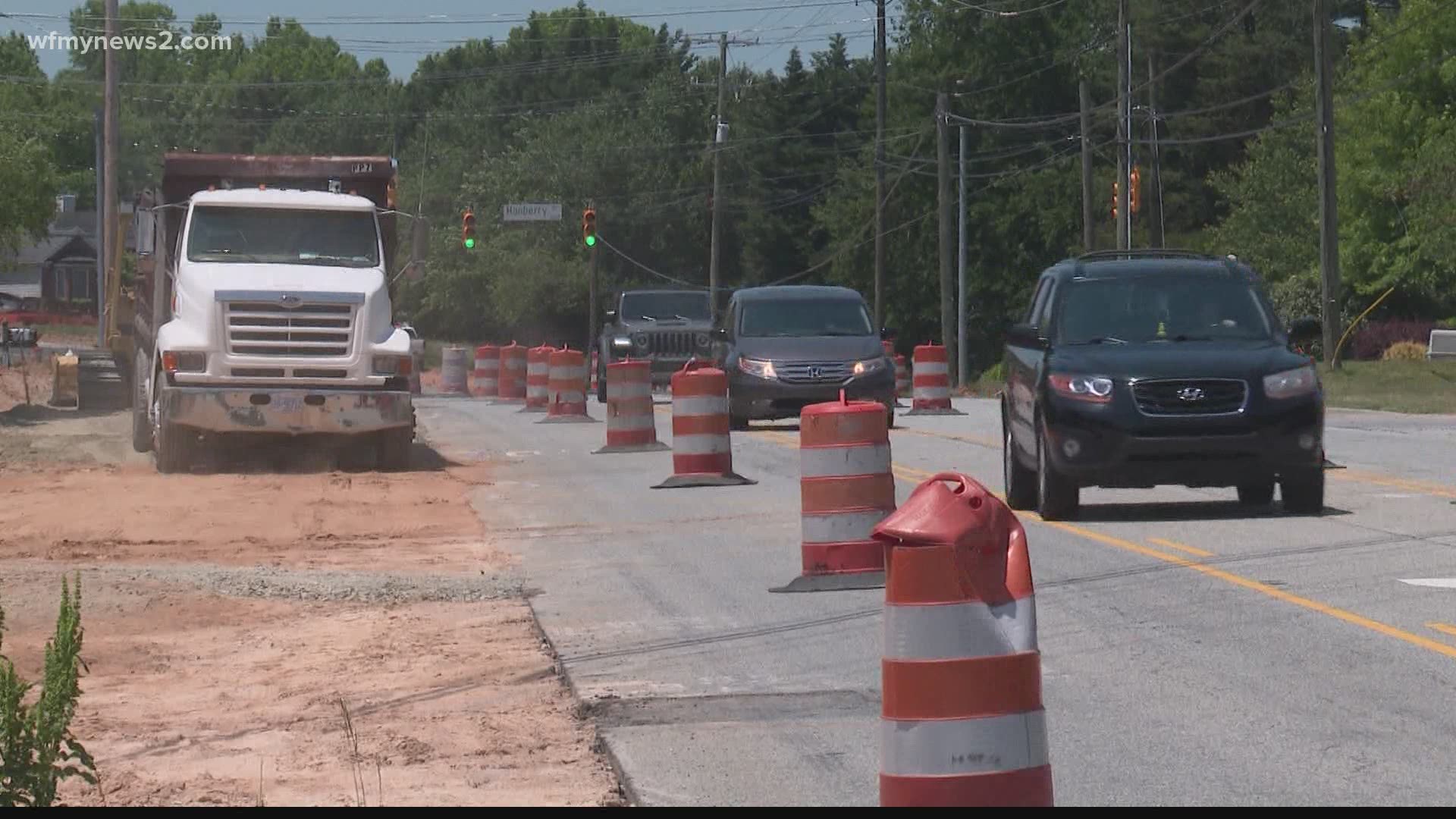 Orange barrels line the streets of some of Greensboro’s busier intersections, but when will the construction be done?