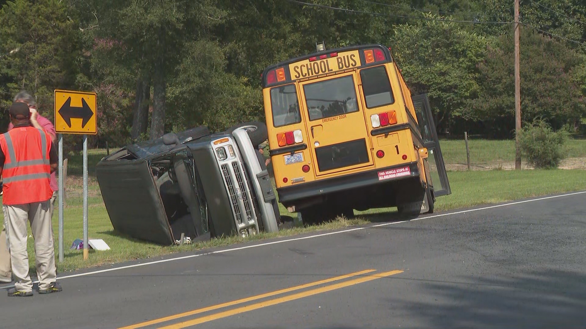 Troopers on scene at Huffine Mill Road and Flemingfield Road told us all four were in the van, and that no children were in the school bus.