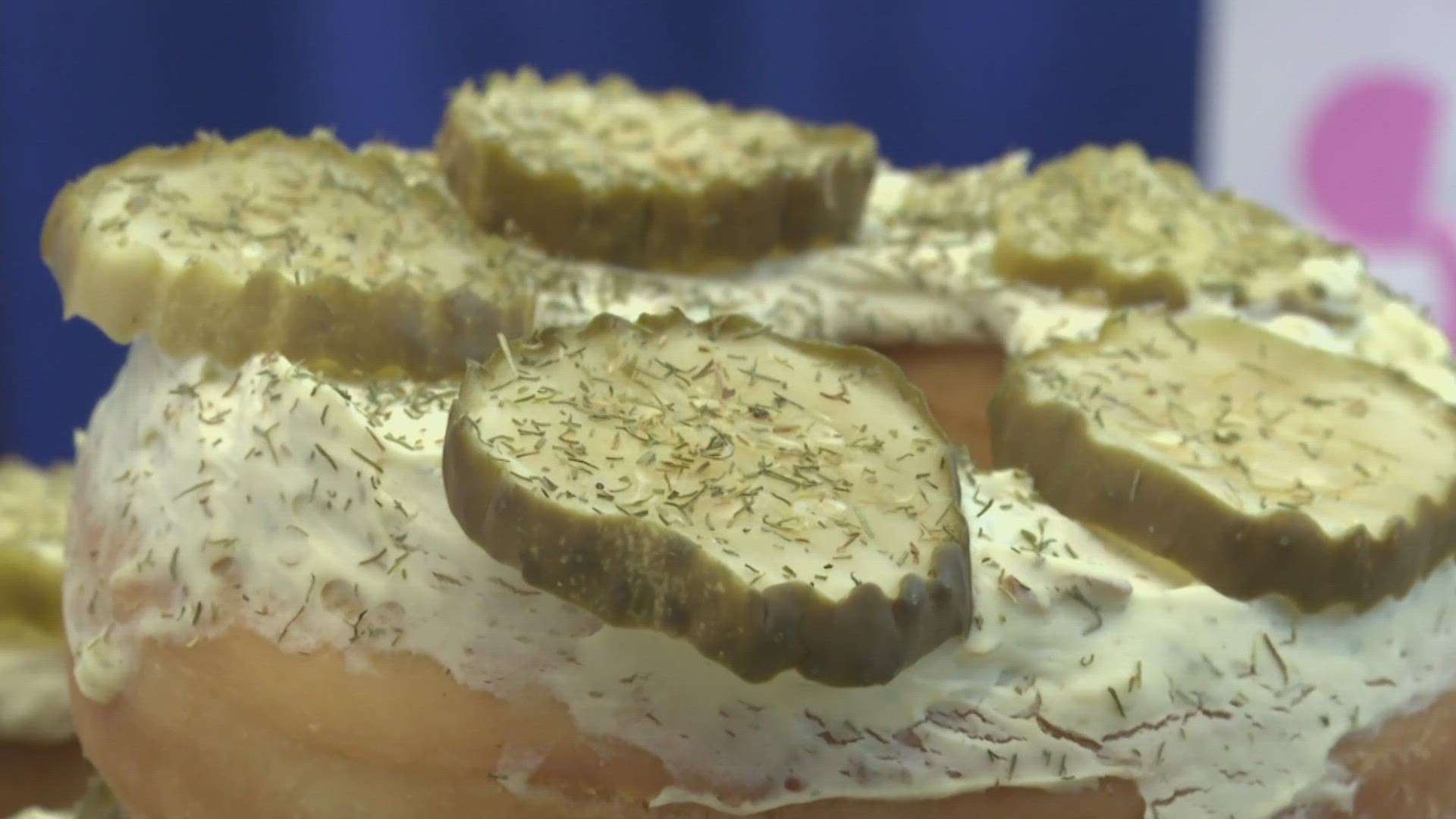 Christian Morgan tries the dill pickle donut ahead of the State Fair.