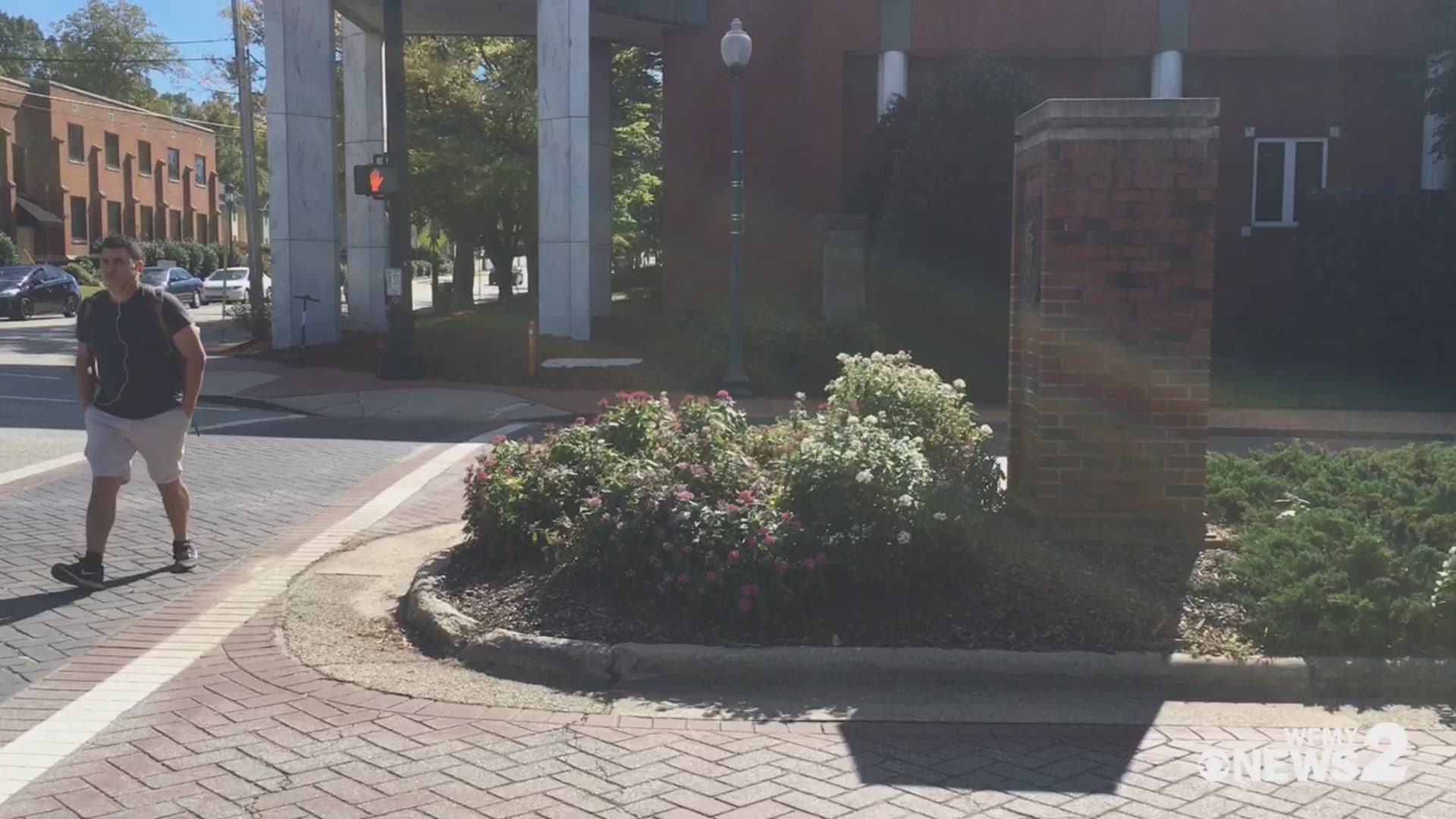 A plaque honoring WFMY News 2's Lee Kinard disappears on the UNCG campus.