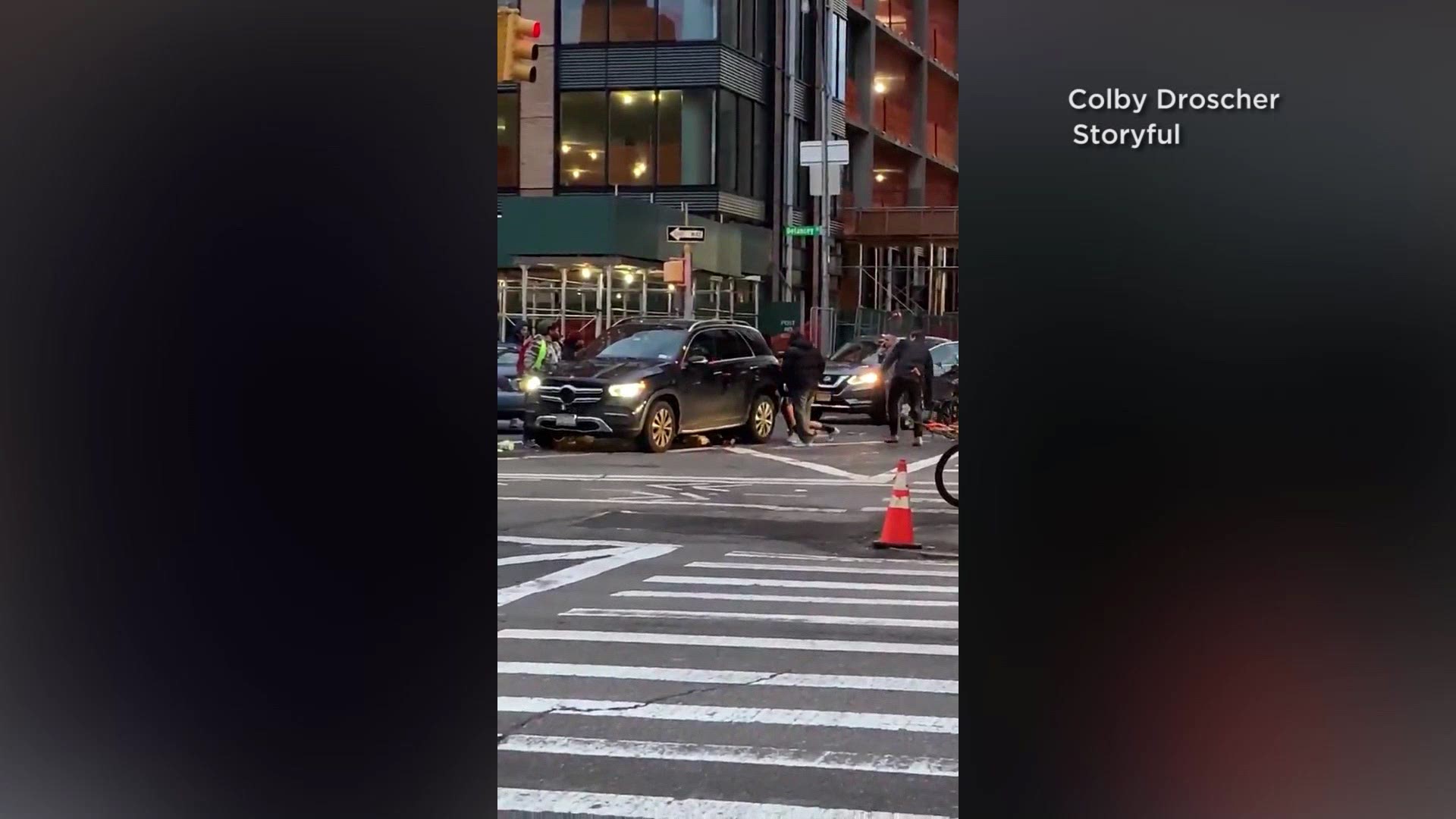 A pedestrian accident left a woman trapped underneath an SUV in New York City. Video shows several people banding together to lift the vehicle and free her.