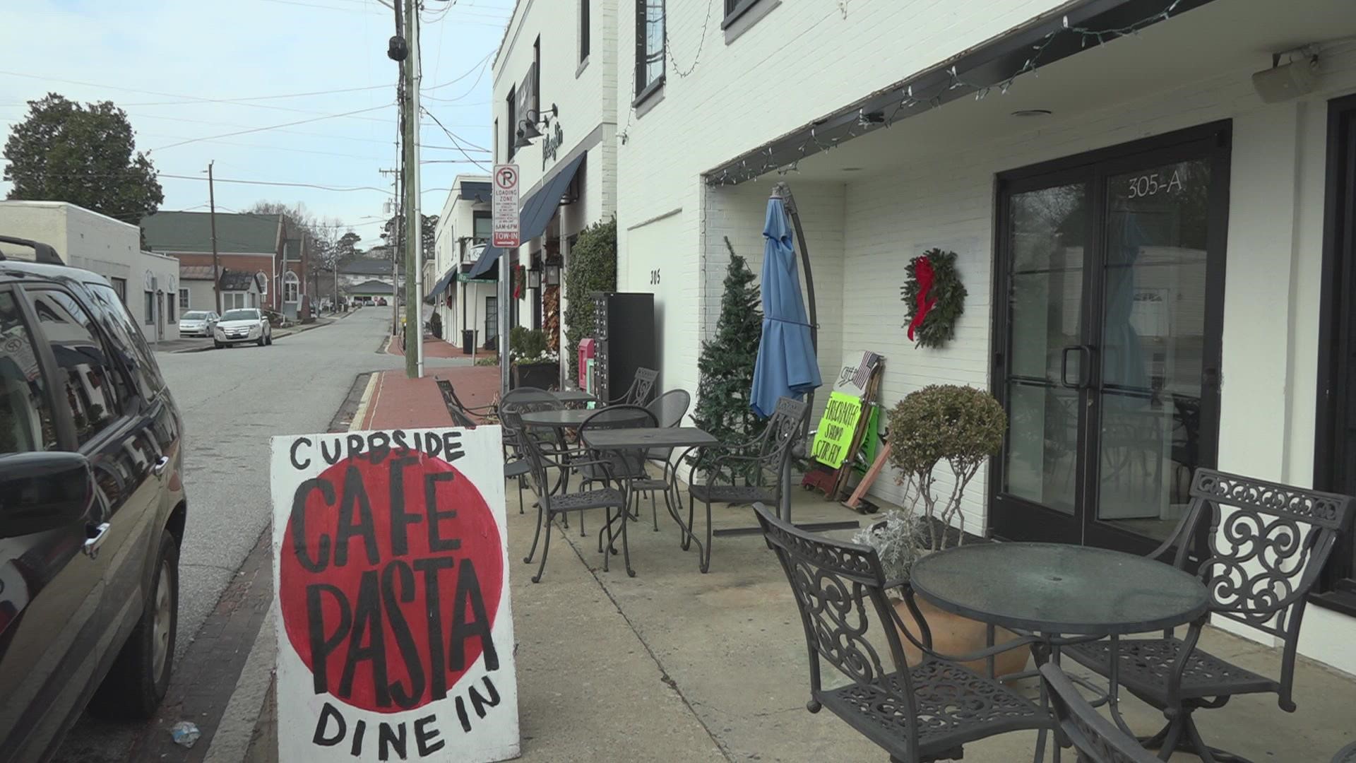 State Street in Greensboro may soon be another place where you can walk around with alcohol as you shop.