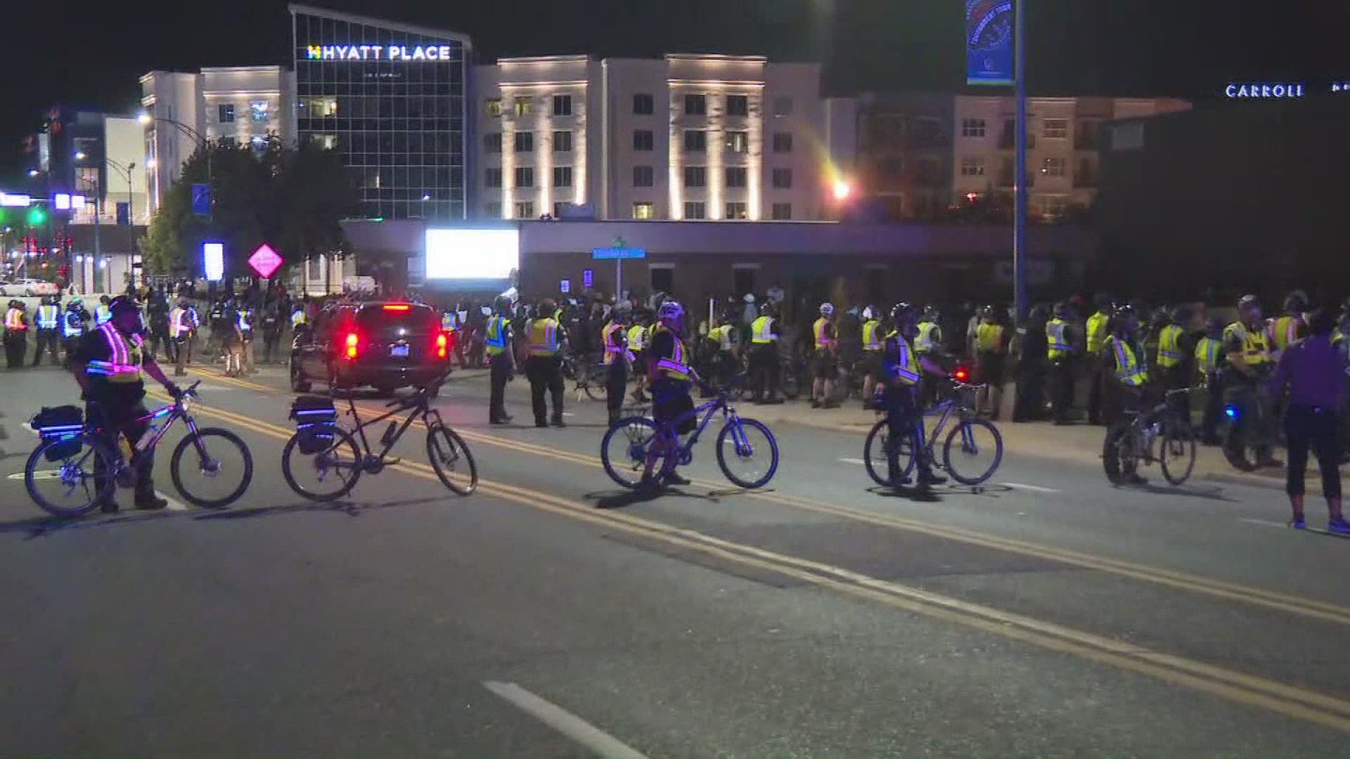 After peaceful protests earlier in the day, fireworks were shot and pepper spray deployed in Downtown Greensboro.