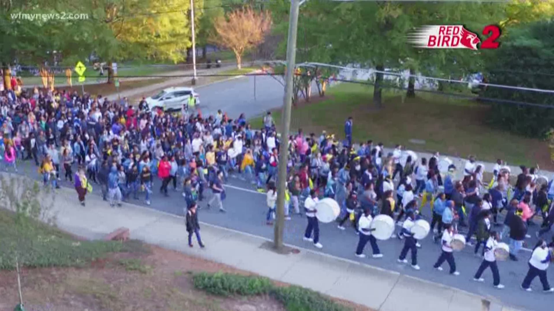 UNC Greensboro students, faculty, and staff walked from campus to the Greensboro Coliseum ahead of tonight’s men’s basketball season tip off game.