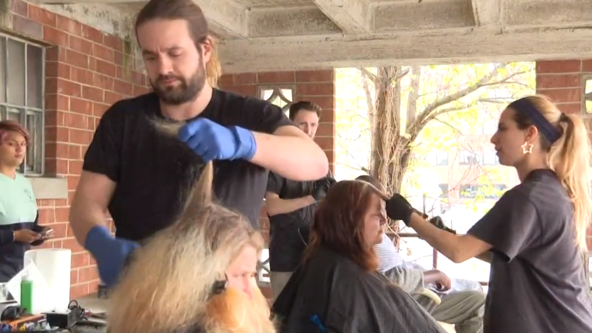 Church under the bridge offers the homeless a free meal, prayer service, music, and tonight haircuts