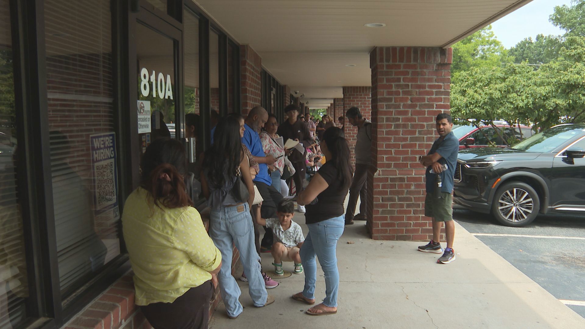 Dozens of people waited at the driver's license office on the main street.