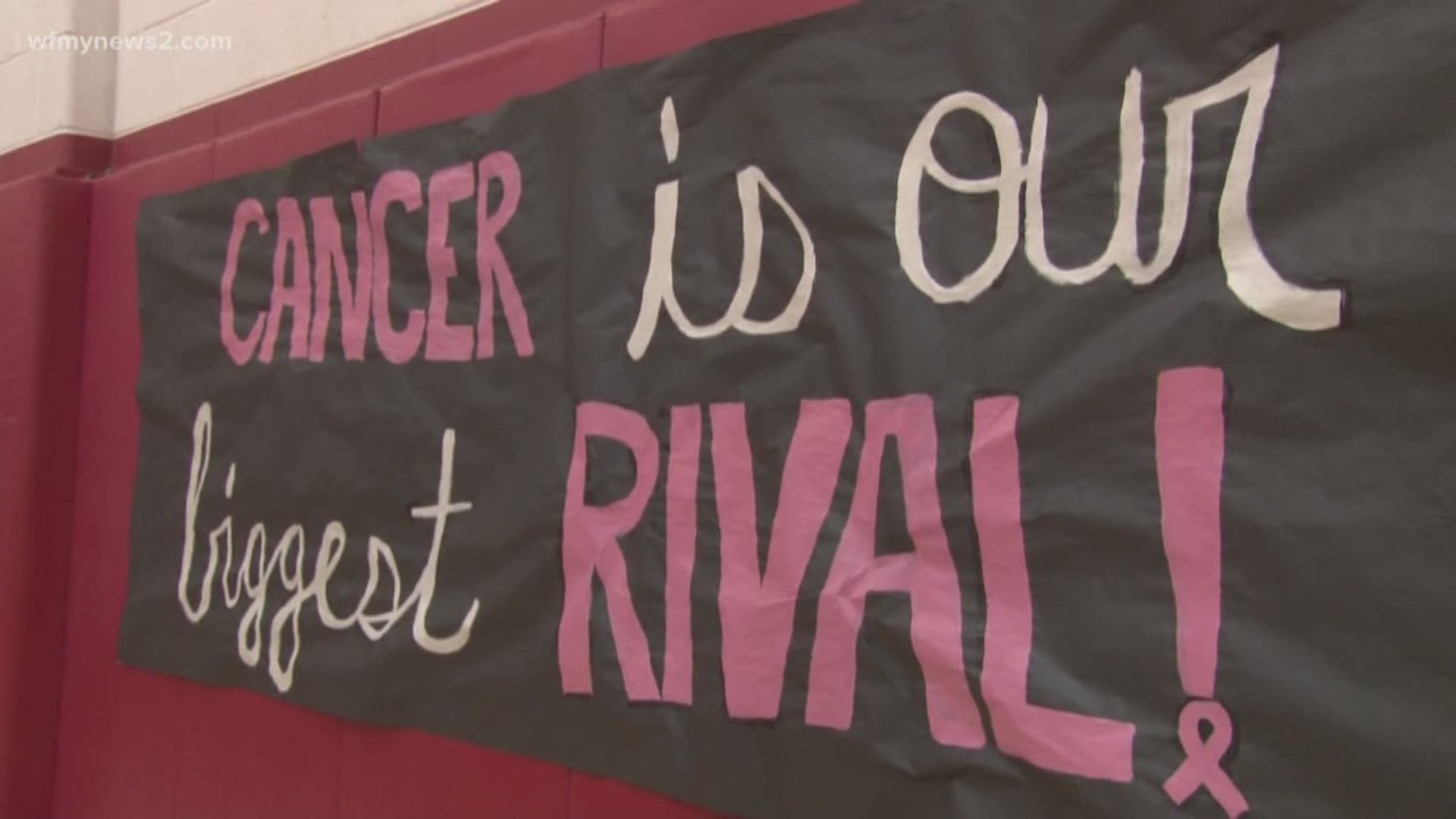 Northern Guilford's head coach battled cancer before, but it came back. Friday night, a former assistant coach and her players all raised money and awareness by wear