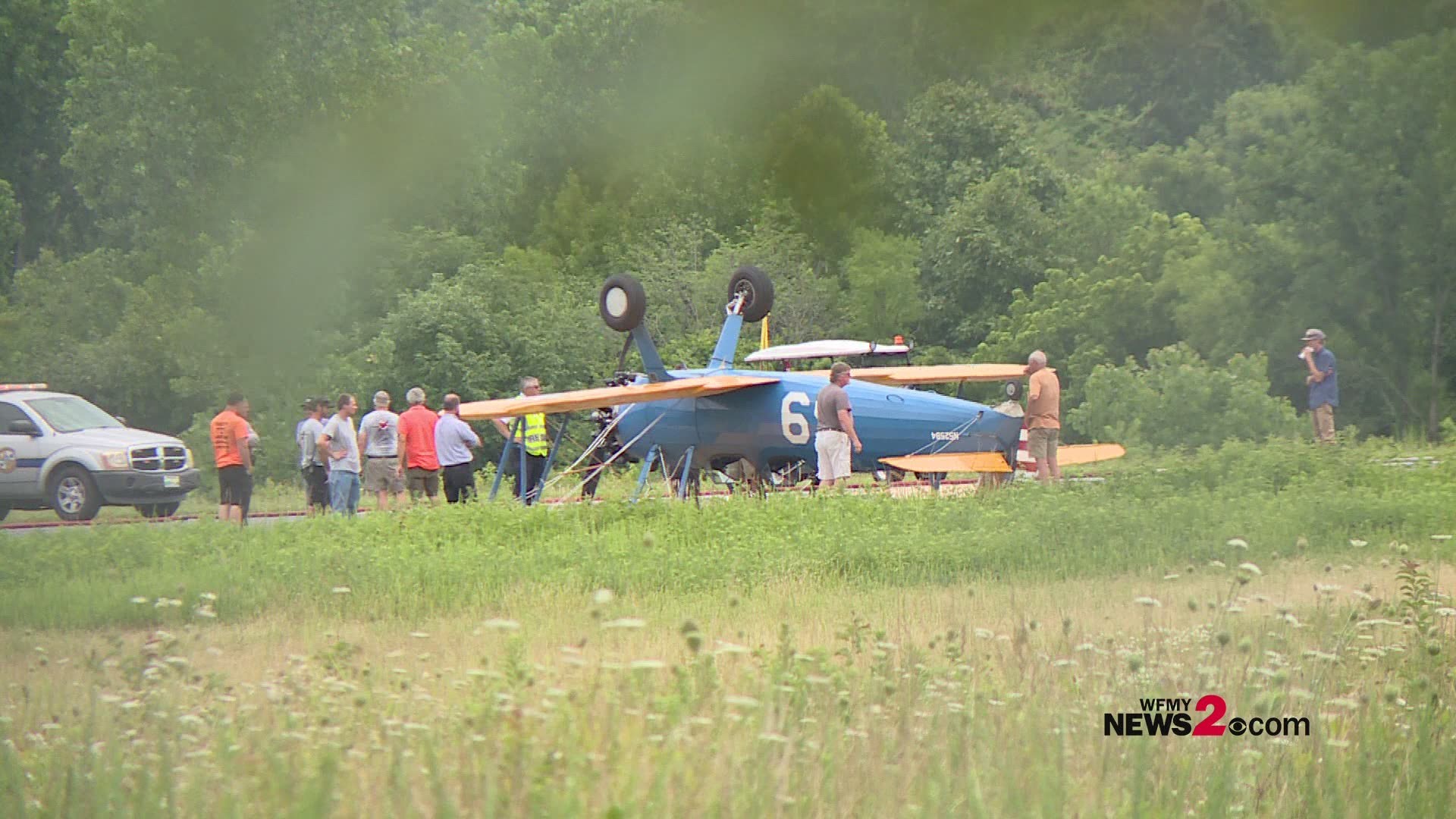 Two people were slightly injured when a small plane flipped after landing at the Lexington Airport in Davidson County, NC