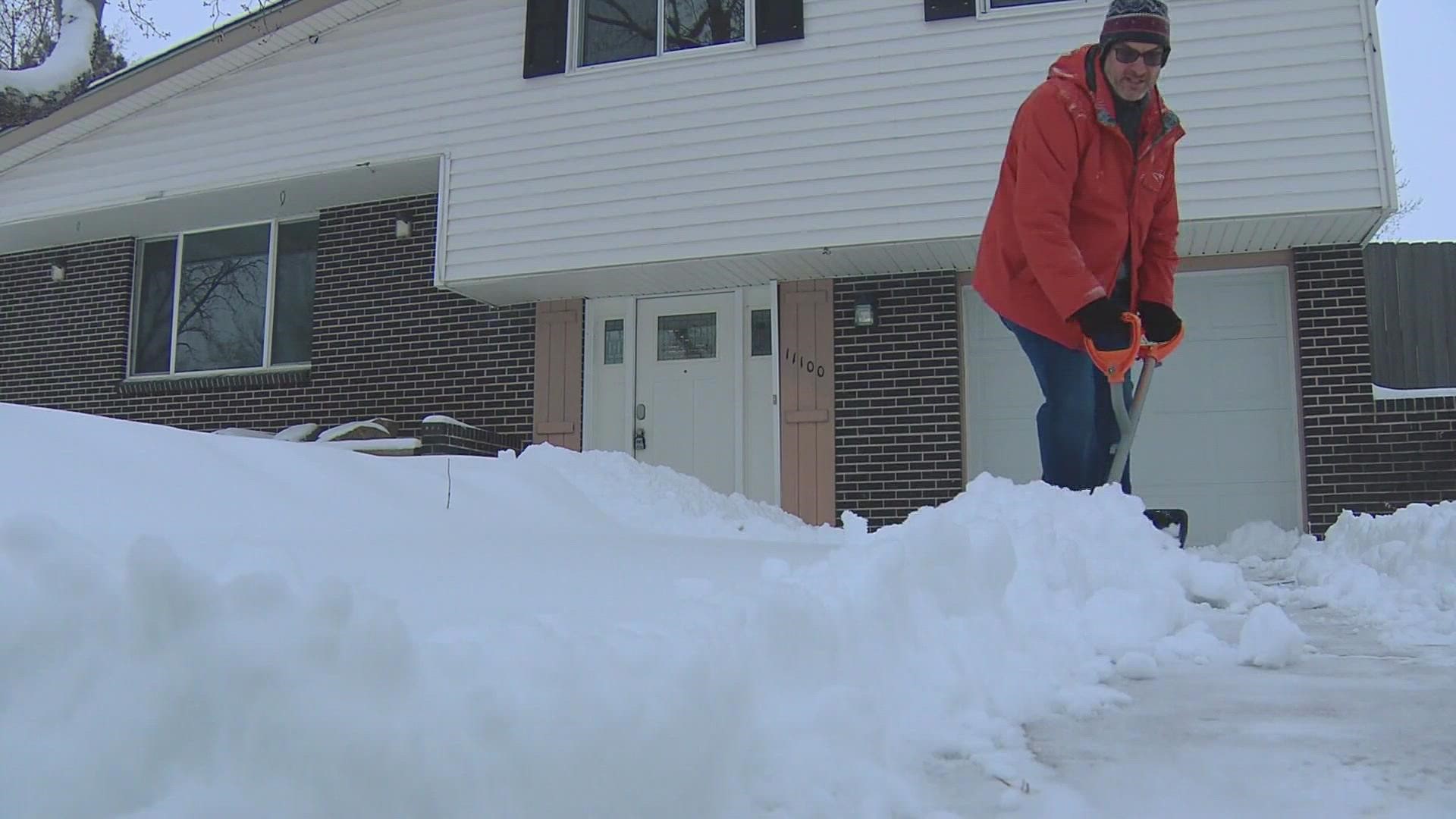 Colorado neighbors help each other shovel snow. What would you do for your neighbor?