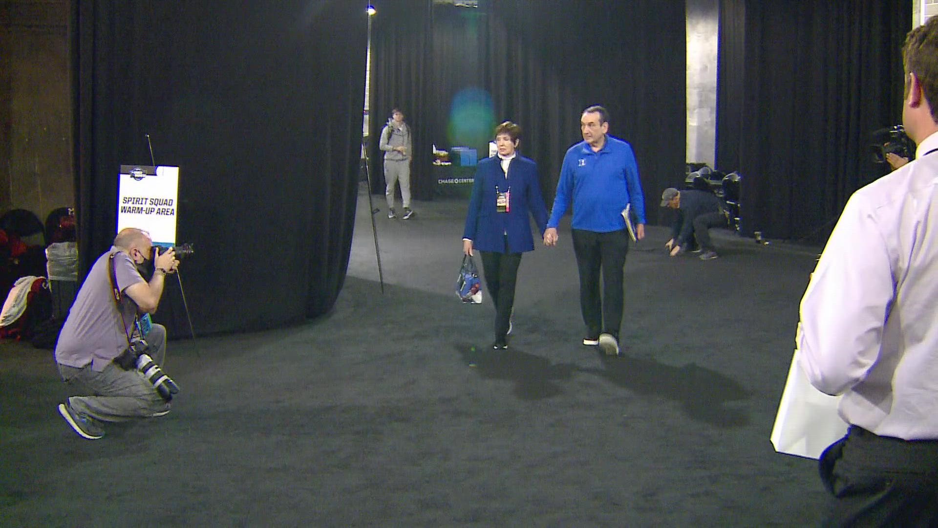 Coach K and his wife walking into the Chase Center for tonight's Sweet