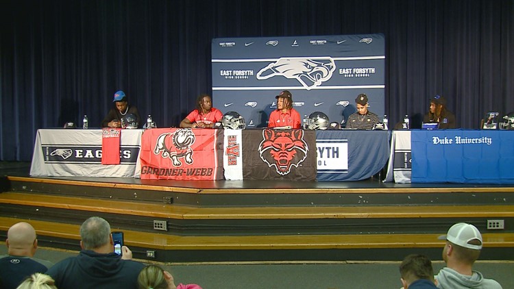 Triad High School Football players put pen to paper on National Signing Day