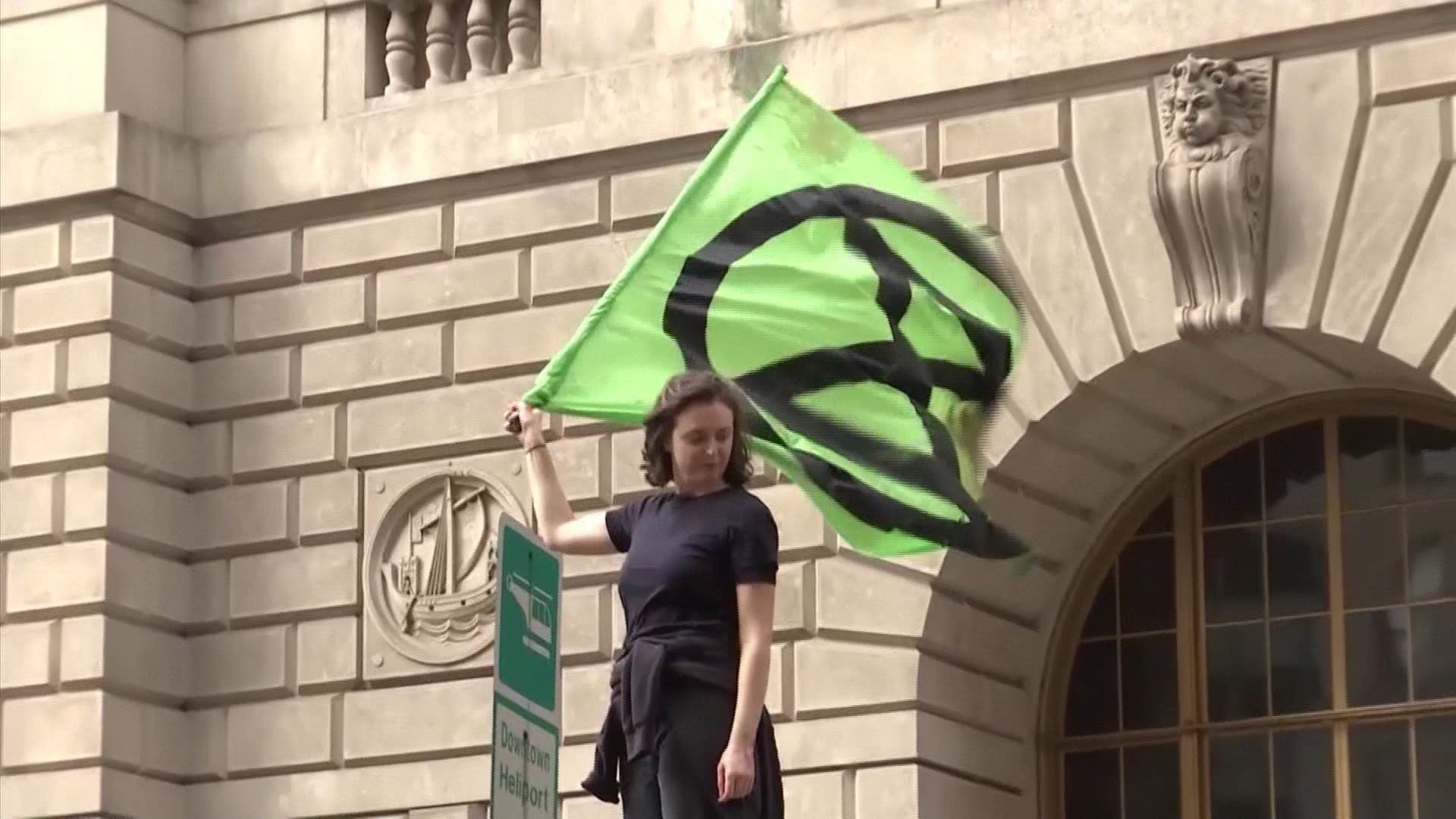 Protesters with Extinction Rebellion have doused the famous charging bull statue in NYC with fake blood as part of a protest against climate change.