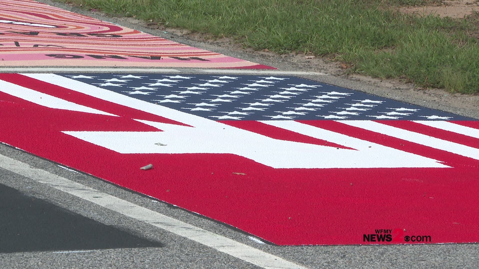 High school students at Northern Guilford painted parking spaces for back-to-school but it wasn't just to claim a space!