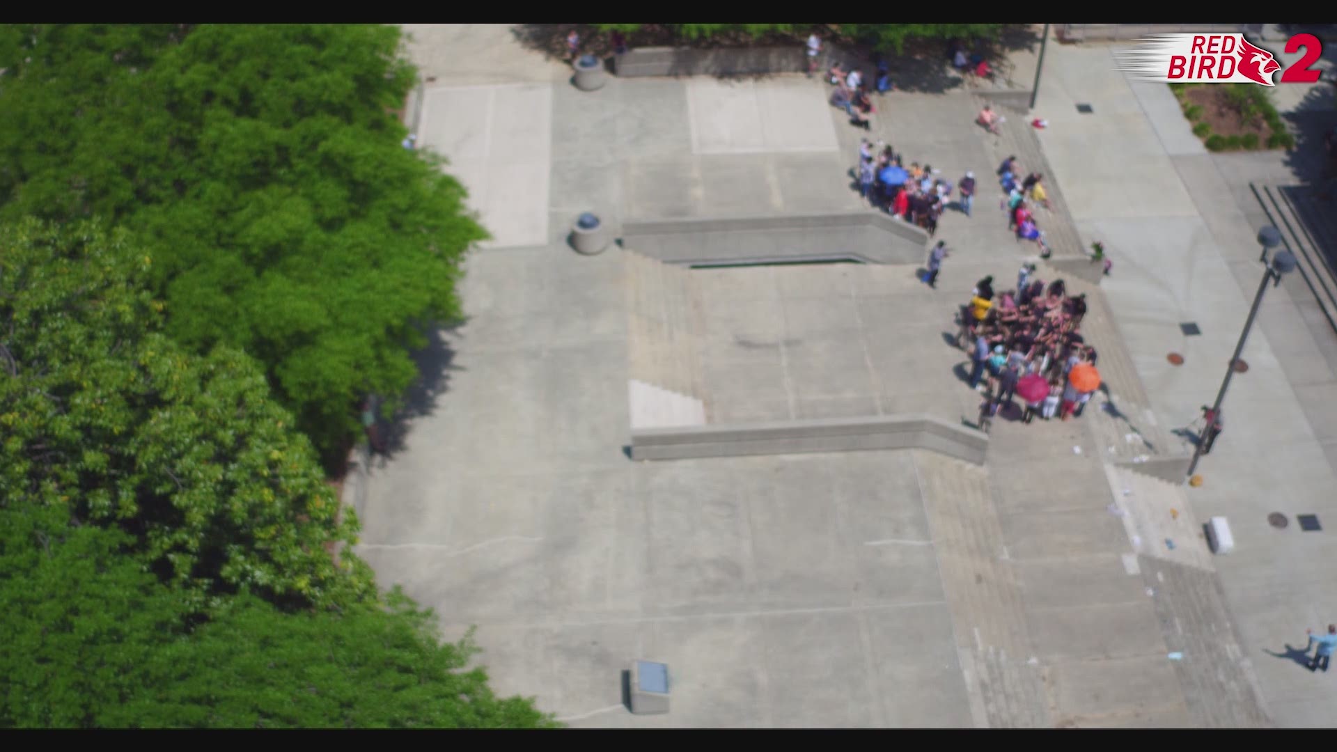 Red Bird 2 Flies Over Prayer at Governmental Plaza