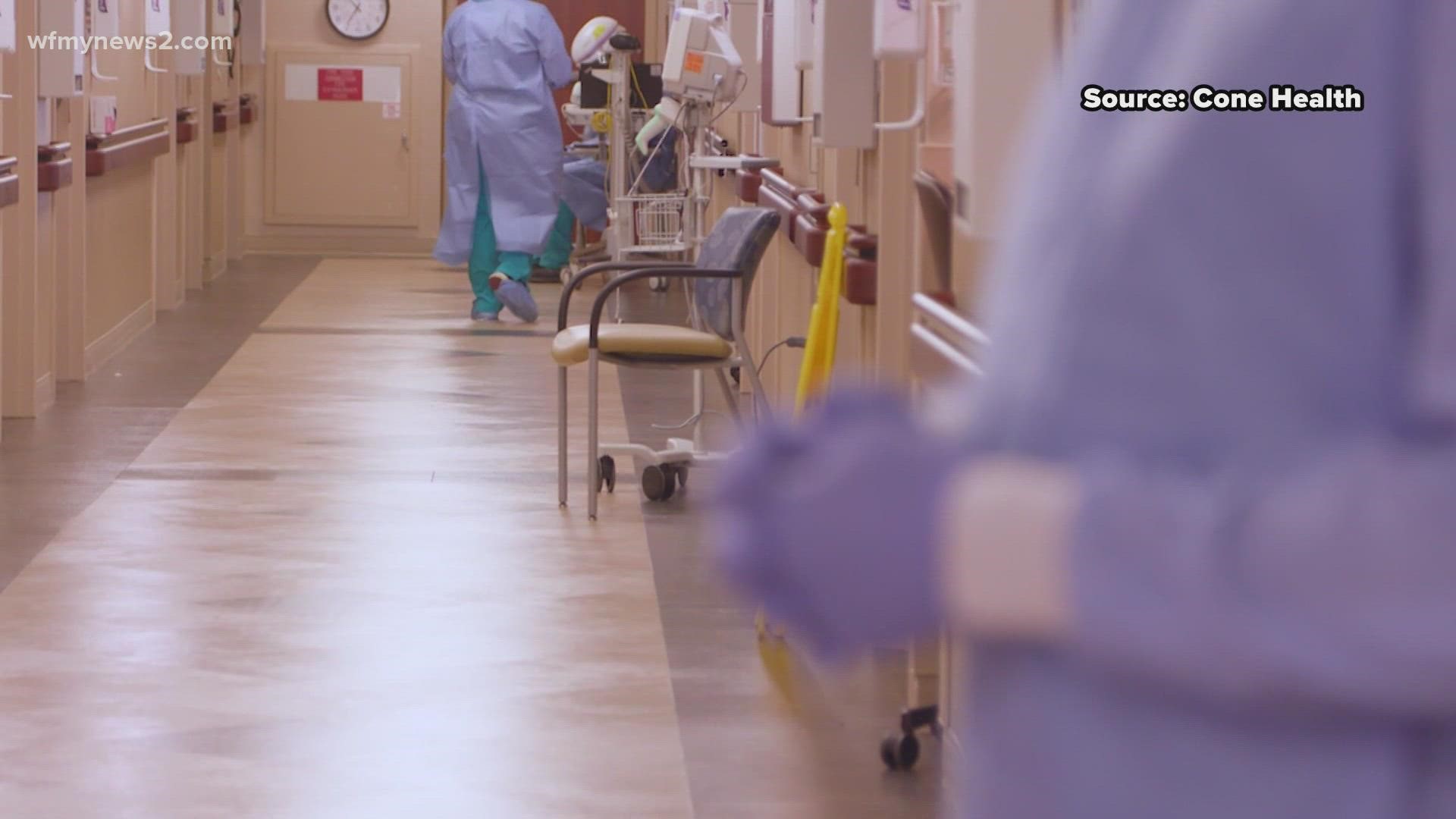 COVID-19 Hospitalizations are surging in the Triad, 2 healthcare workers said it's overwhelming.