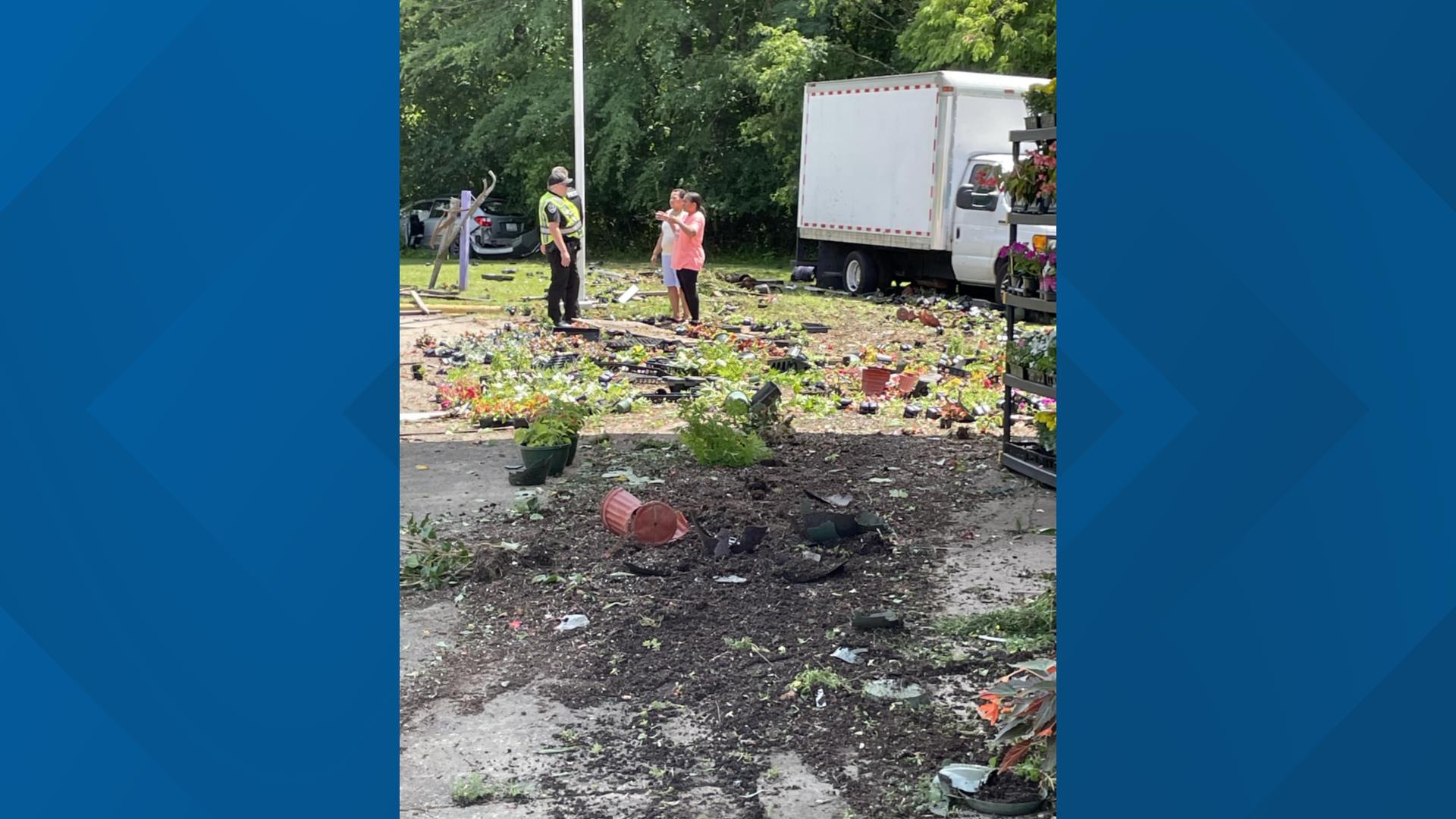 Eden family cleaning up after car plows into their produce stand ...