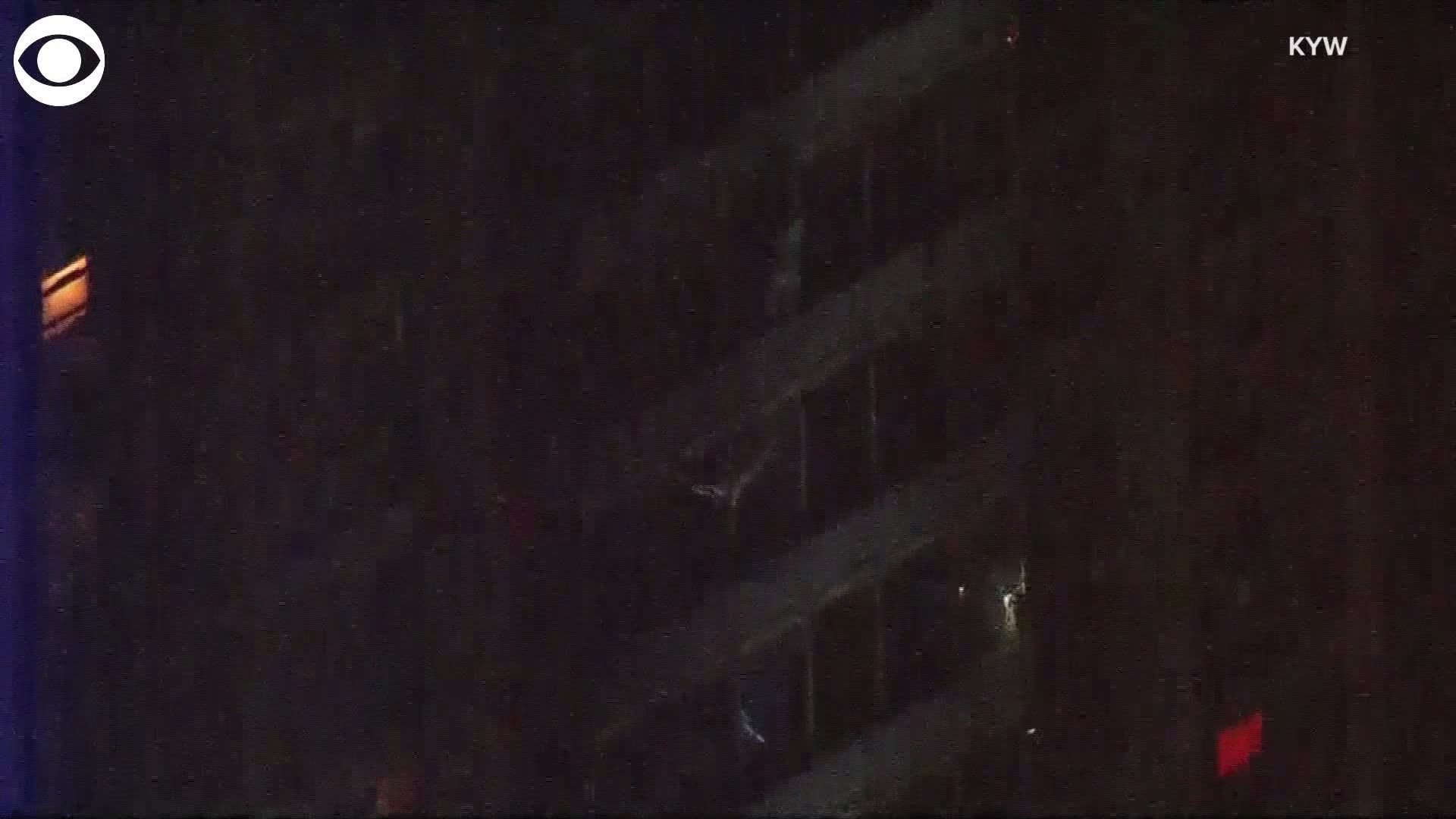 A man clung to the outside of a West Philadelphia high-rise and then climbed down at least 14 floors after a fire caused a building evacuation. Take a look at how the risky move helped him escape.
