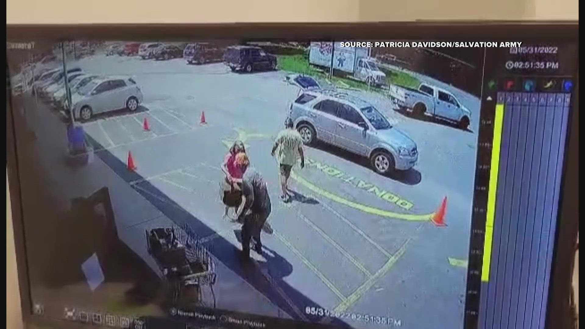 A Salvation Army surveillance video captured a man jumping into an SUV to stop a thief. A family said the man stole their keys and tried to drive away.