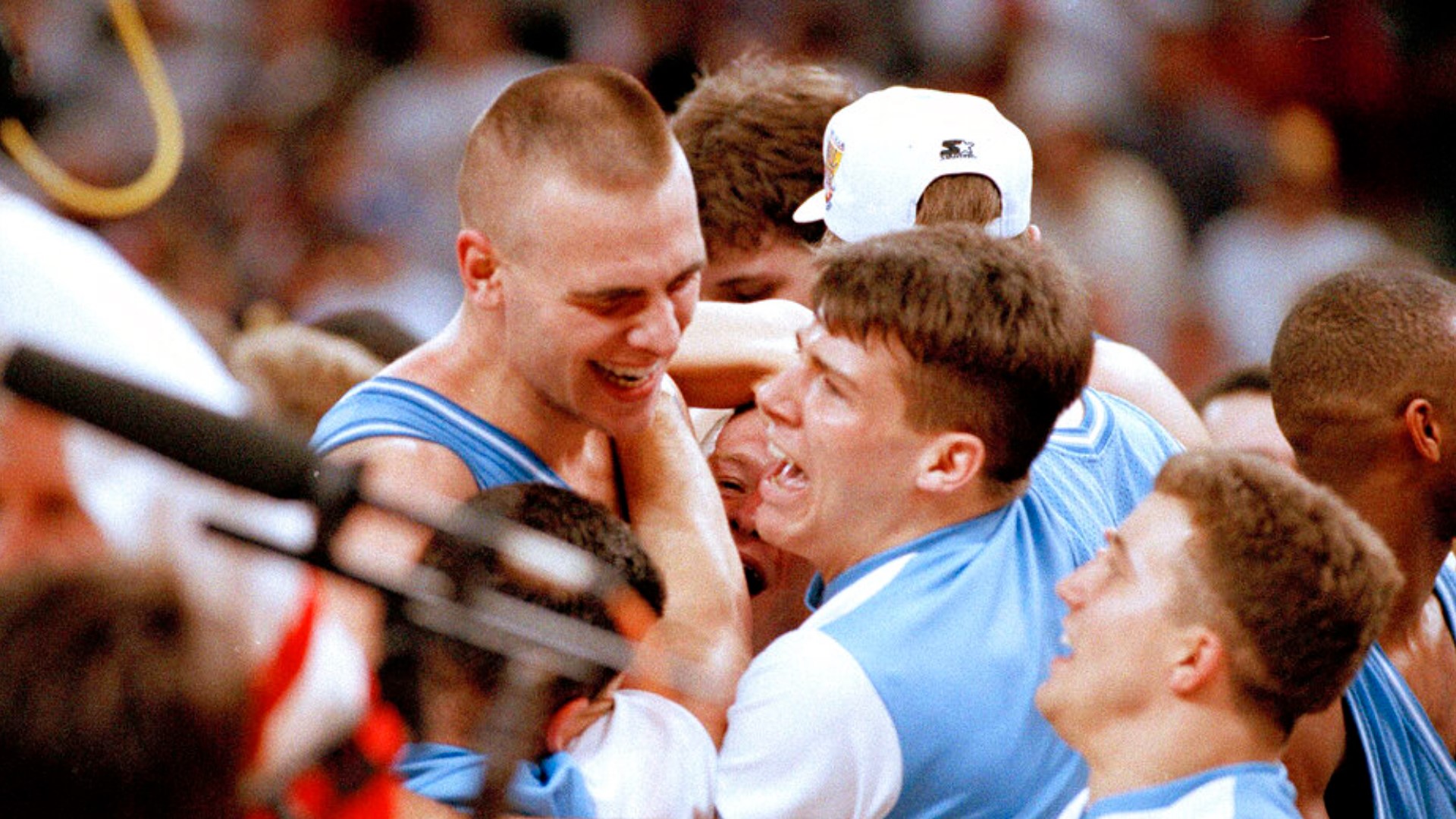 The 7-footer played for Carolina from 1990-1994 under Hall of Fame coach Dean Smith. He started at center for the 1993 National Championship team.