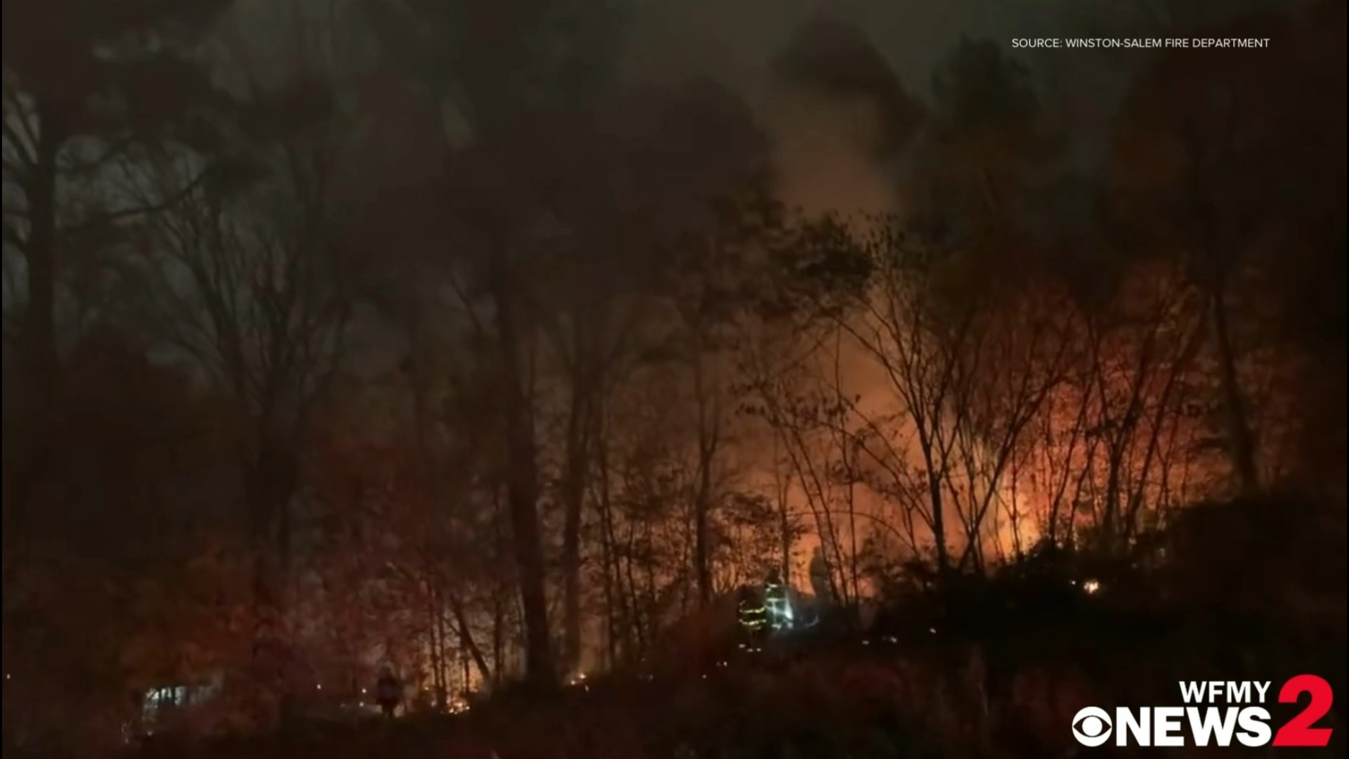 Crews are on the scene of a brush and woods fire between Peters Creek and Hutton Street in Winston-Salem, according to fire officials.